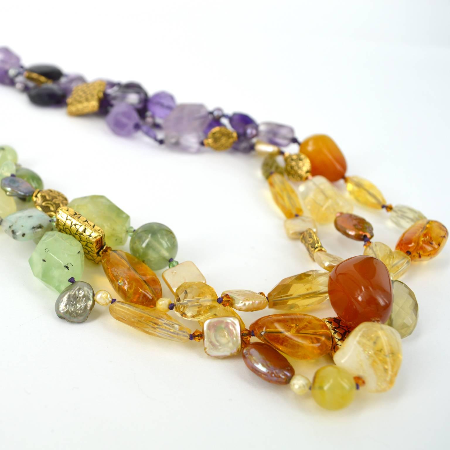 Graduating from vibrant Amethyst to Citrine mixed with Carnelian, to finish with the soft tones of Prehnite with Chalcedony, Kiwi stone and Jade this whole design is augmented with dyed Fresh Water Pearls, 3mm Swarovski Beads and antiqued Gold plate