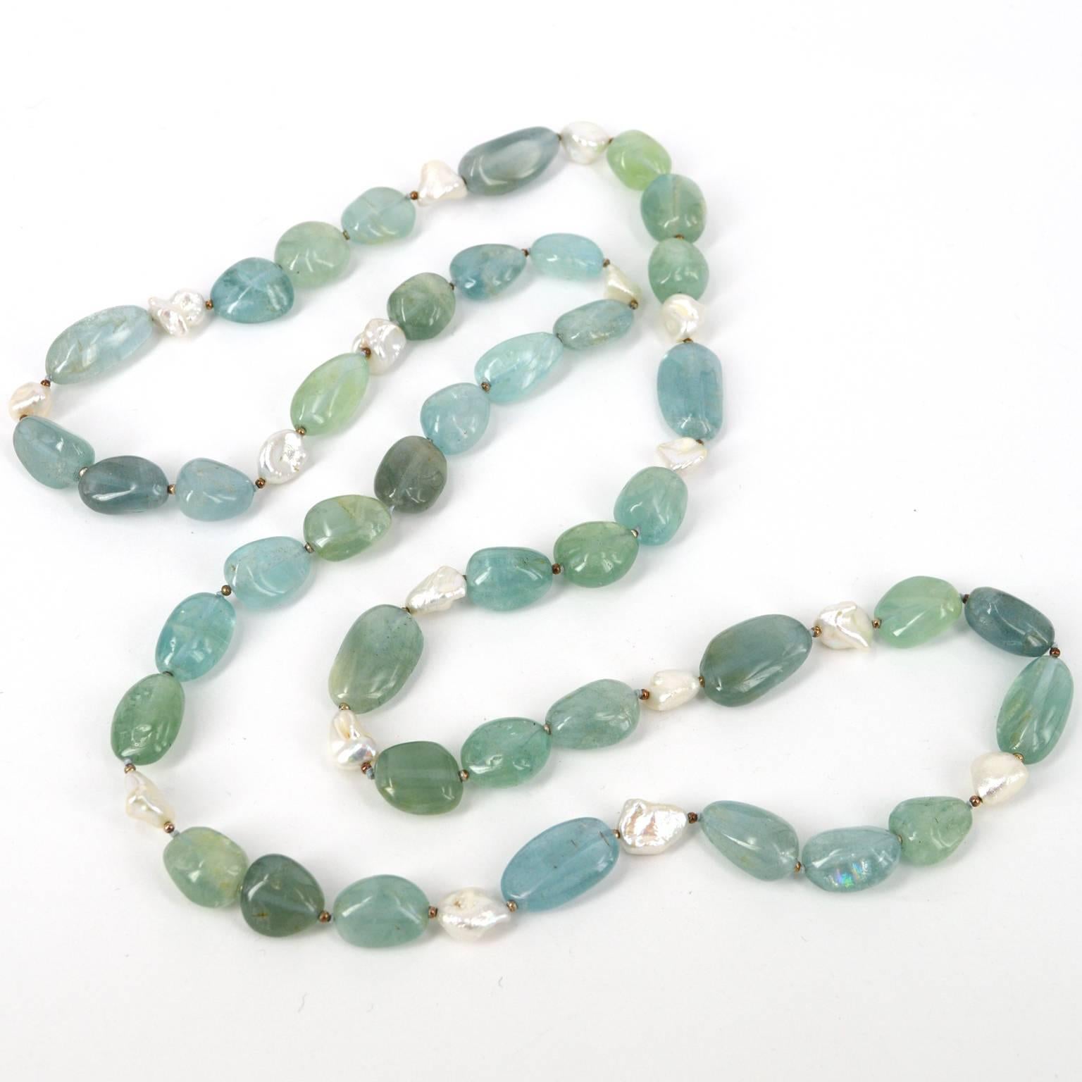 Blue, Greens and Aquas of this natural Aquamarine nugget hand knotted necklace are spaced with 16 x 10mm Keshi Fresh Water Pearls and spaced by oxidised 2mm Sterling Silver beads. Aquamarine nuggets range from 12x15mm up to 12x24mm.
All stones are