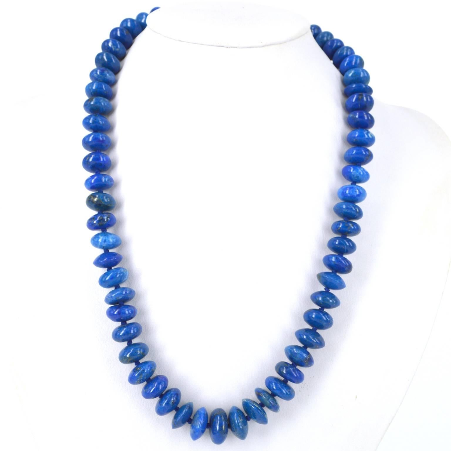 Natural Lapis Lazuli polished roundels graduating 11x7mm up to 15x7.5mm hand knotted with complimentary coloured thread and a 13.5mm Gold Plate Sterling Silver Bolt Clasp. Finished necklace measures 55cm.

All stones are natural and as such may