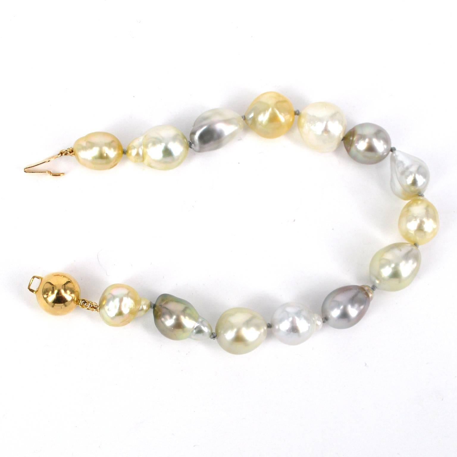 Hand knotted on soft grey thread these South Sea and Tahitian Pearls have a gorgeous soft glow of silver grey and gold tones. Baroque pearls range from 10mm to 14mm with a 10mm vermeil clasp.

All Pearls are natural and as such may include natural