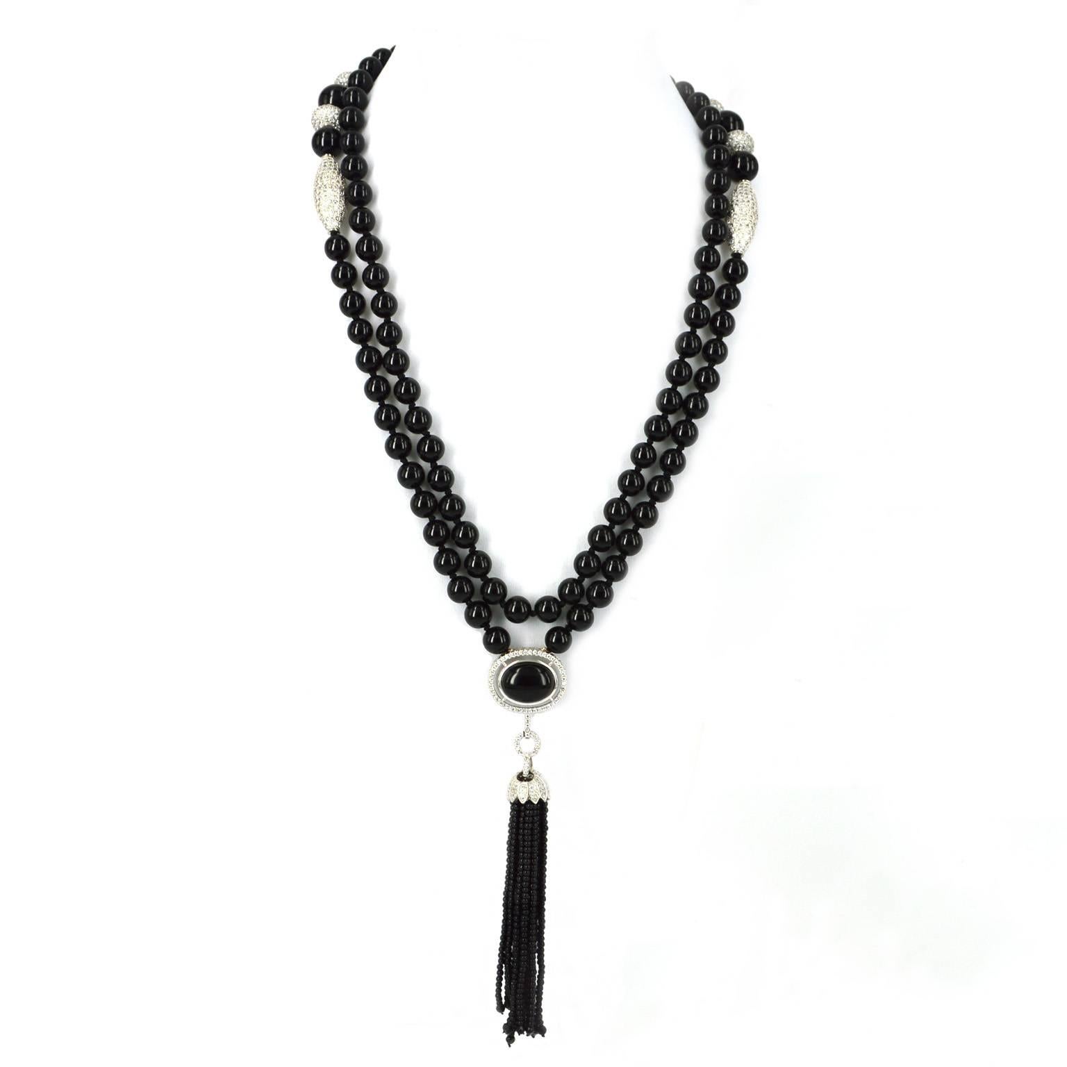 Art Deco inspired long necklace.
8mm round polished Onyx and Rhodium plated CZ beads. Hand made onyx tassel made from 2mm polished round onyx. A stunning Onyx and CZ feature above the tassel. Tassel length 90mm from cap.
Total necklace length