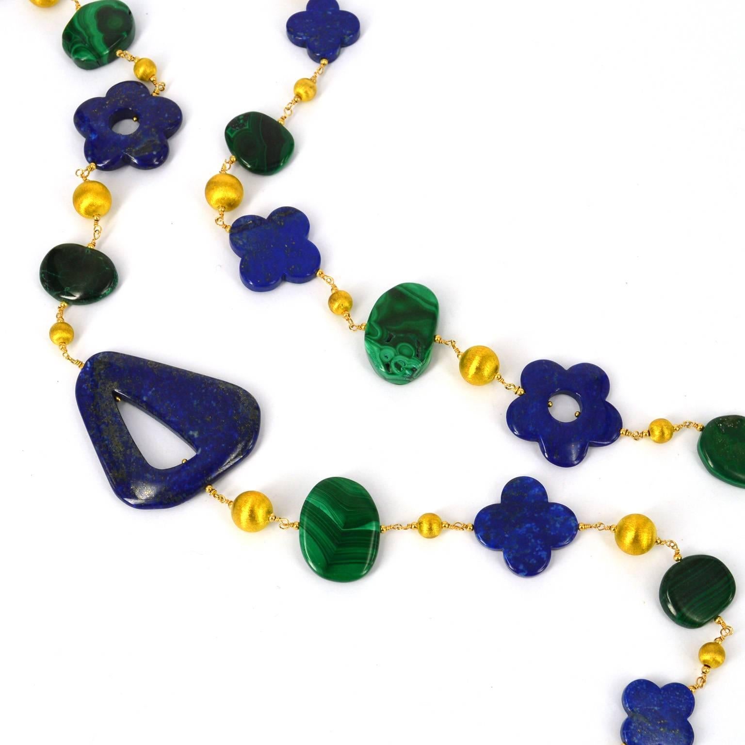 Lapis Lazuli and Malachite long necklace hand made wire wrapped with 14k gold filled wire.
Chain of mix shapes from nuggets to flowers. Feature Lapis bead measures 50mm.
Brushed vermeil 8mm and 10mm beads. 
Total length of necklace 100cm.

All