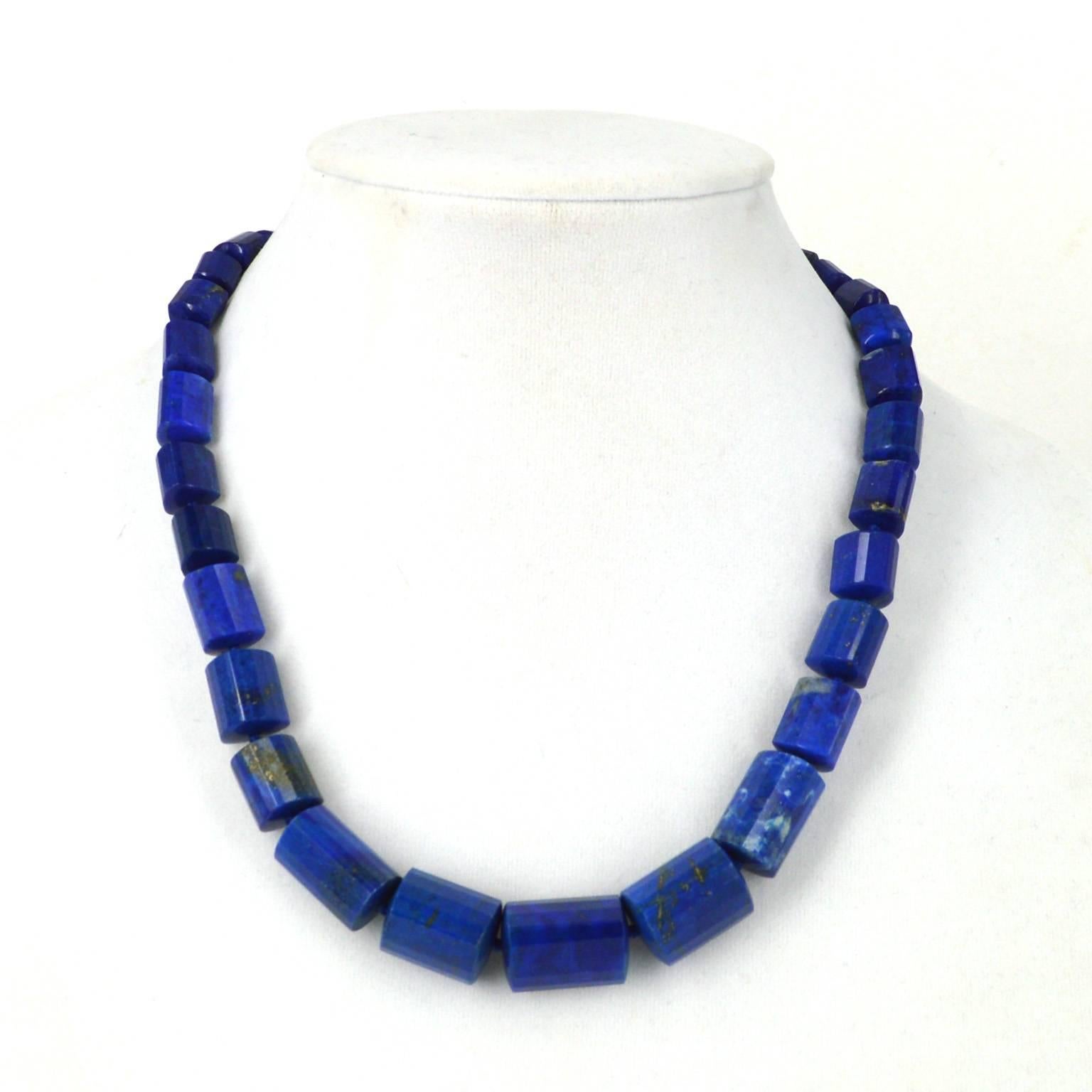 Stunning faceted Lapis Lazuli tubes that graduate around the neckline.
Hand knotted on navy thread with an 8mm vermeil ball clasp.
Total length of necklace 46cm.
Lapis graduates from 8mm - 20mm.

All stones are natural and as such may include