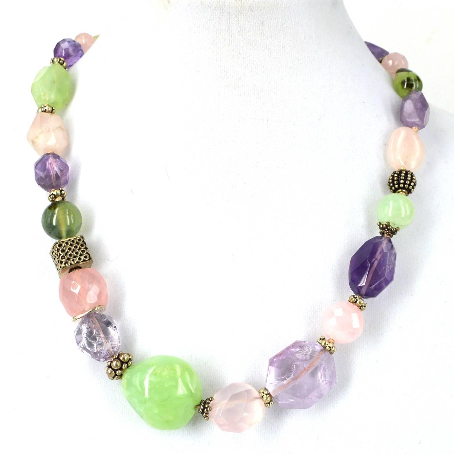 Soft natural Faceted and Polished necklace with Amethyst, Rose Quartz and Prehnite spaced with solid Sterling silver beads and spacers 51cm knotted necklace.  Largest bead is Prehnite bead measuring 24x26mm.

