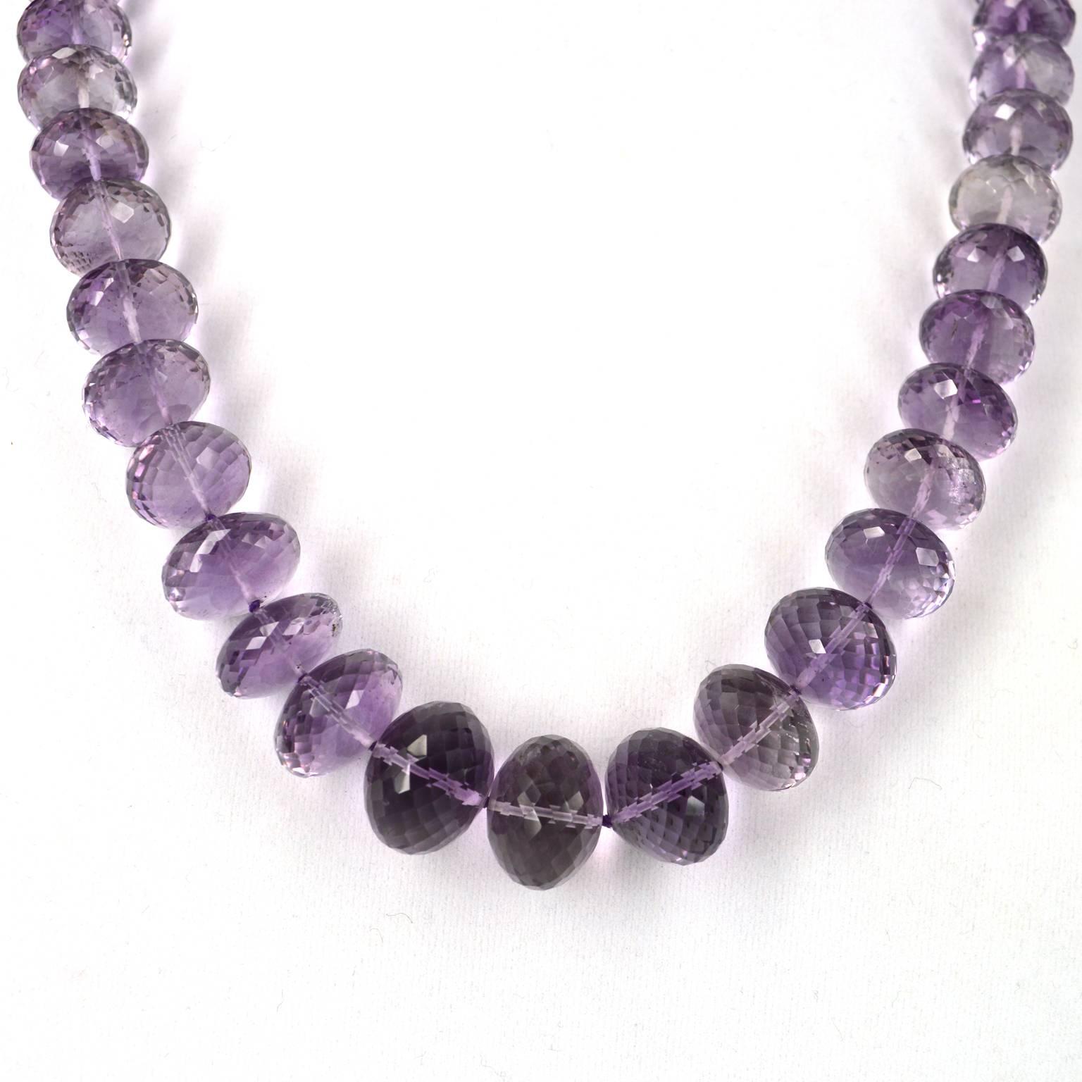 Beautifully Graduated Strand of multi Faceted Pink Amethyst beads graduating from 9x6mm up to 16.4x12.5mm. Hand knotted on purple thread with a solid 9ct Gold clasp. Necklace measures 56cm