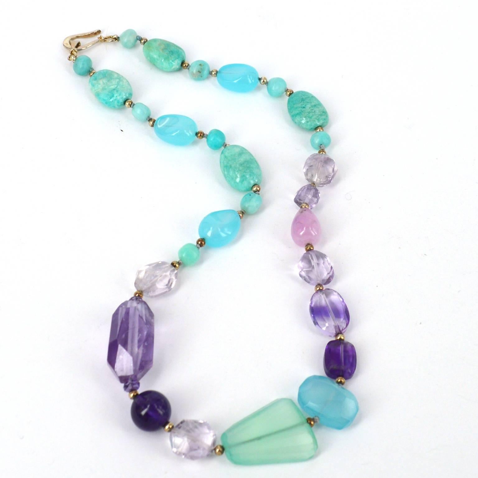 Aqua and Purple mix in together delicately in the pretty necklace.
Stones are a beautiful mix of Peruvian Amazonite, Chalcedony, Kunzite and Amethyst spaced with oxidised 3mm Sterling silver beads.
Necklace has been hand knotted on pale aqua