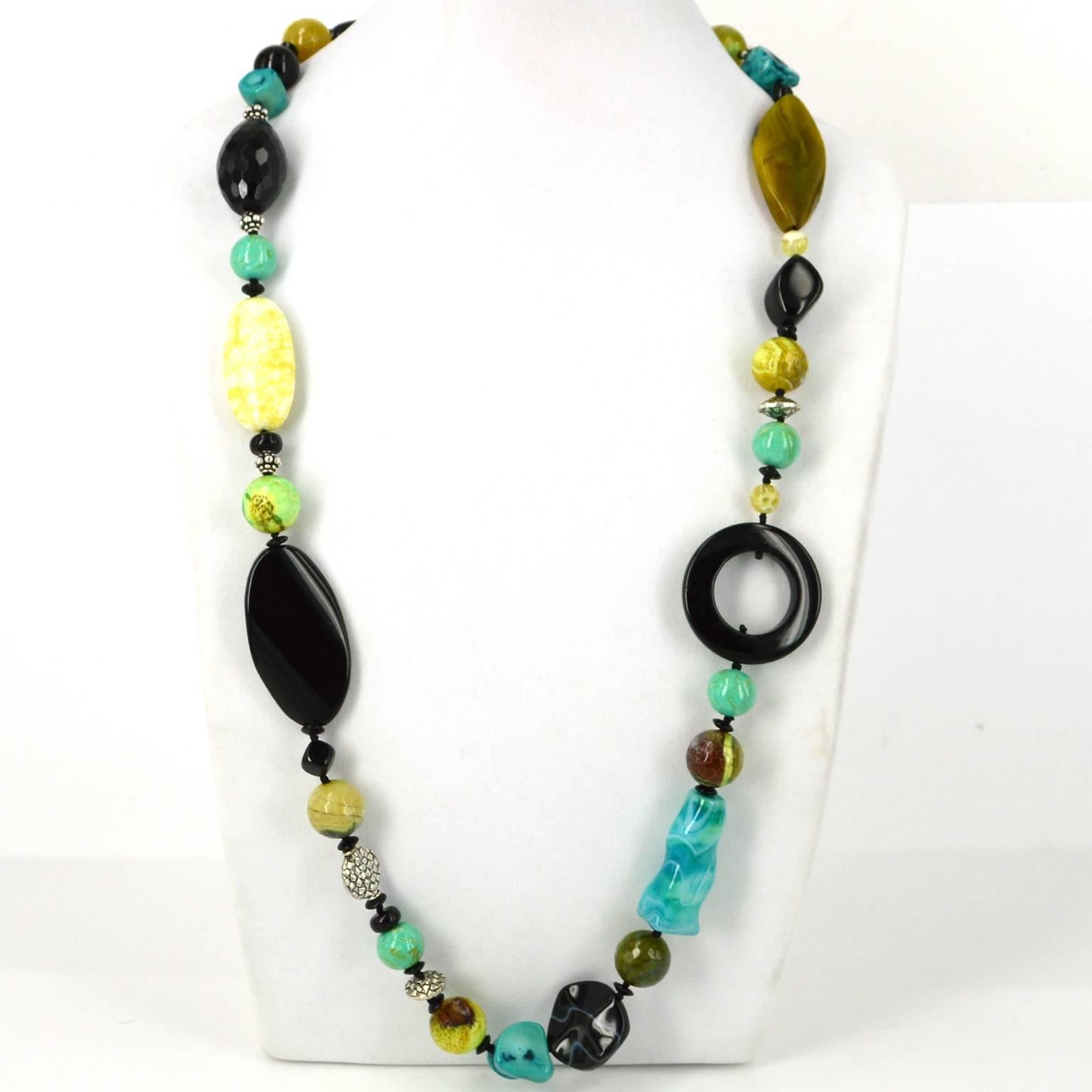 90cm hand knotted on blacl with large accent knots this necklace is a mix of Black agate, Onyx, Lemon Jade, Crackled and Dyed Agate, Sea Bamboo Coral, Round resin beads and Silver plate Copper spacer beads. I love this as it goes with so many other