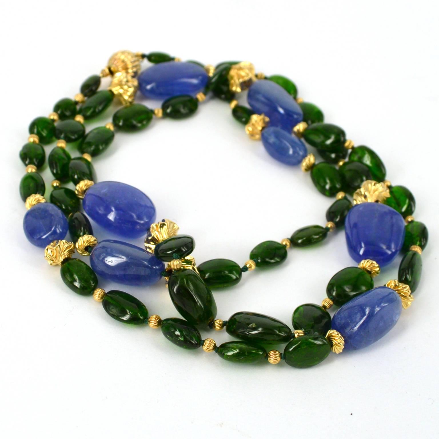 Vibrant  emerald green Chrome Diopside polished nuggets graduated 8-15mm with 8 polished Tanzanite nuggets 14-19mm hand knotted on Emerald colour thread. Necklace is spaced with 2mm congregated, 6mm Twist rondels and 8x7mm Twisted bead, finished