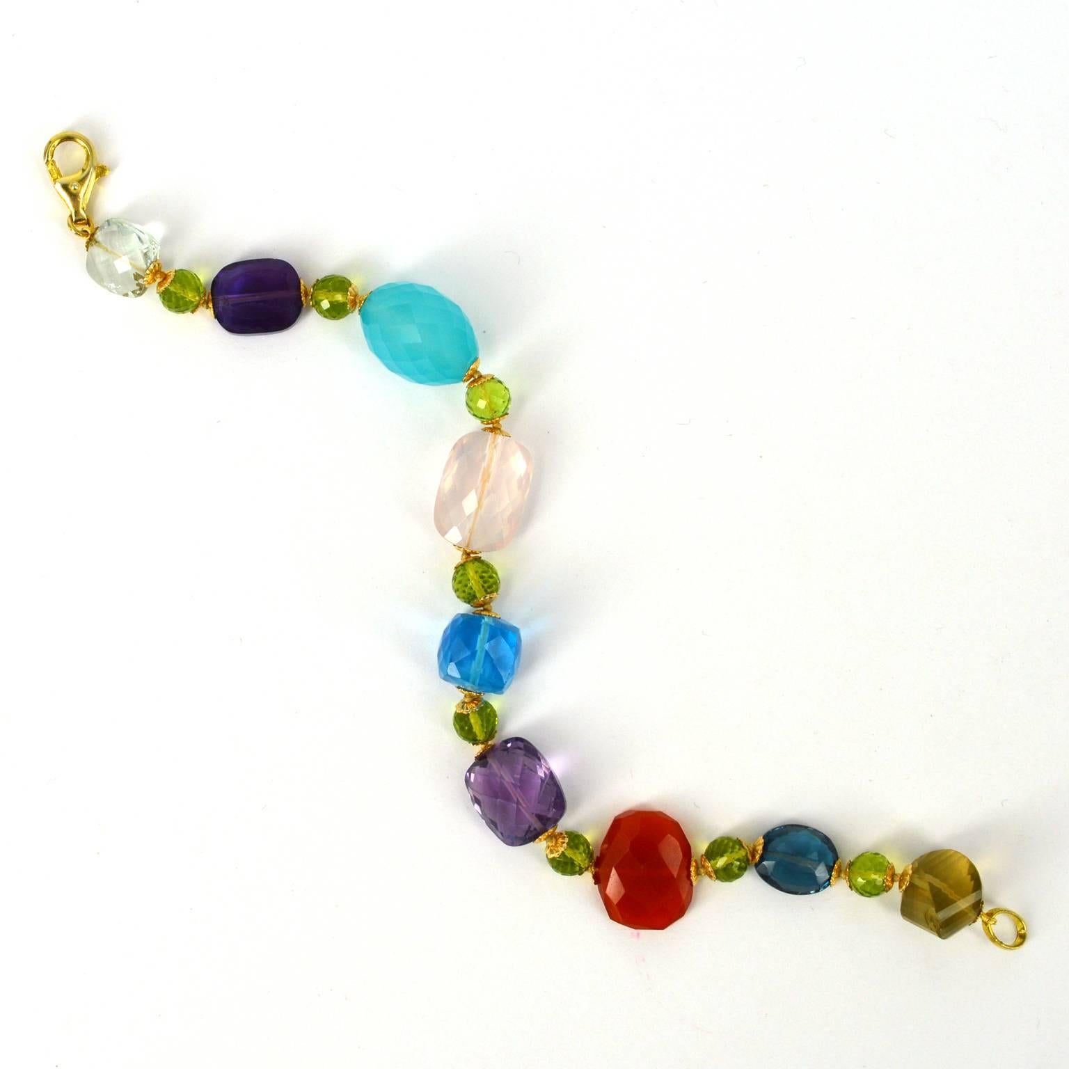 A mix of gemstones in all shapes and sizes make this piece really interesting. 
Amethyst beads, Lemon Quartz, Rose Quartz, Chalcedony, Peridot, London Blue Topaz and Green Amethyst.
Hand knotted on thread with 14k gold filled beads caps and