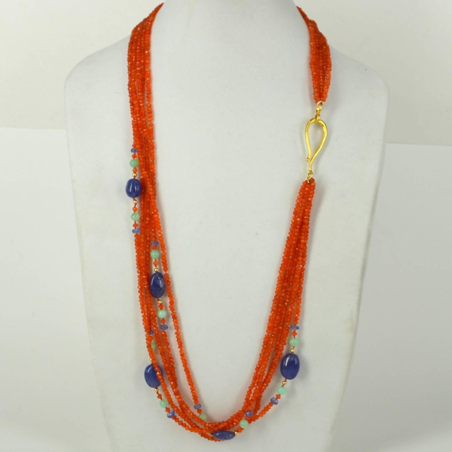 5 Strands of Faceted 4x3mm Carnelian Beads spaced with faceted Tanzanite beads, 6mm Australian Chrsophrase and 5 polished Tanzanite nuggets ranging from 12.8-9.3mm to 16.6x12.2mmon Gold beads are 3mm 14k Gold filled beads and necklace is finished