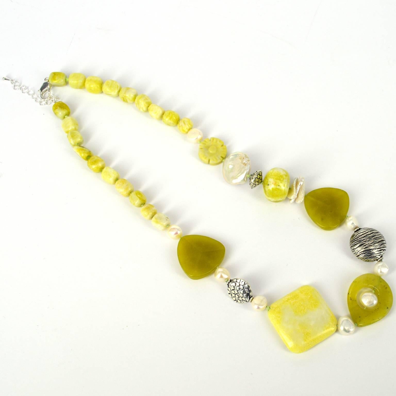 Korean, olive green stone, and Lemon Jade mixed with Fresh Water Pearls and Silver plate beads and Clasp. The largest diamond shape Lemon Jade bead is 30x30mm. 
Knotted on matching lime coloured thread with and extension chain this necklace can be