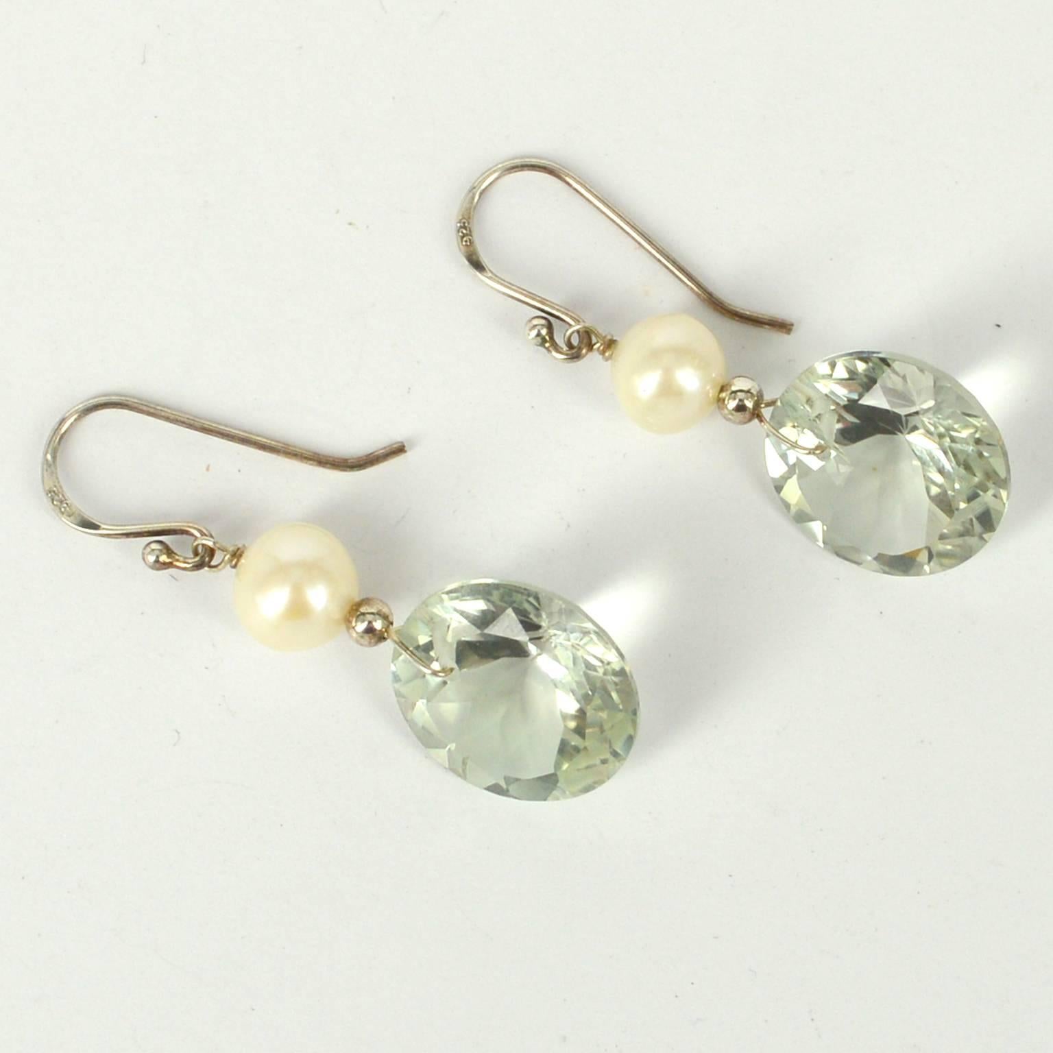 Stunning 17mm top drill Green Amethyst round stones sit below 8mm Fresh Water Pearls with Sterling Silver beads headpins and sheppards.
Finished earrings measure 41mm