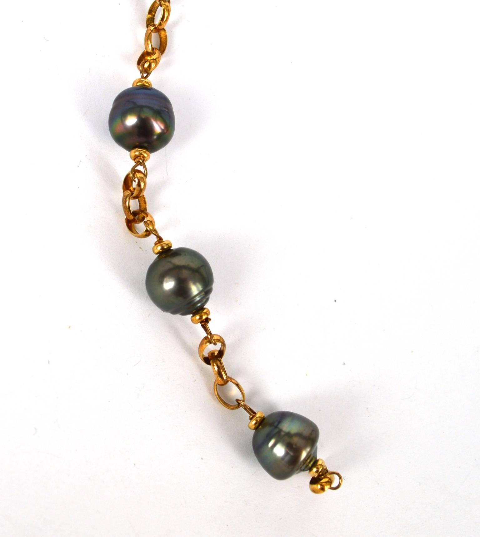 9 Carat gold chain and clasp with a feature of Tahitian pearls.
19cm in total length
Pearls are approximately 10mm in size.

All pearls are natural with natural inclusions.