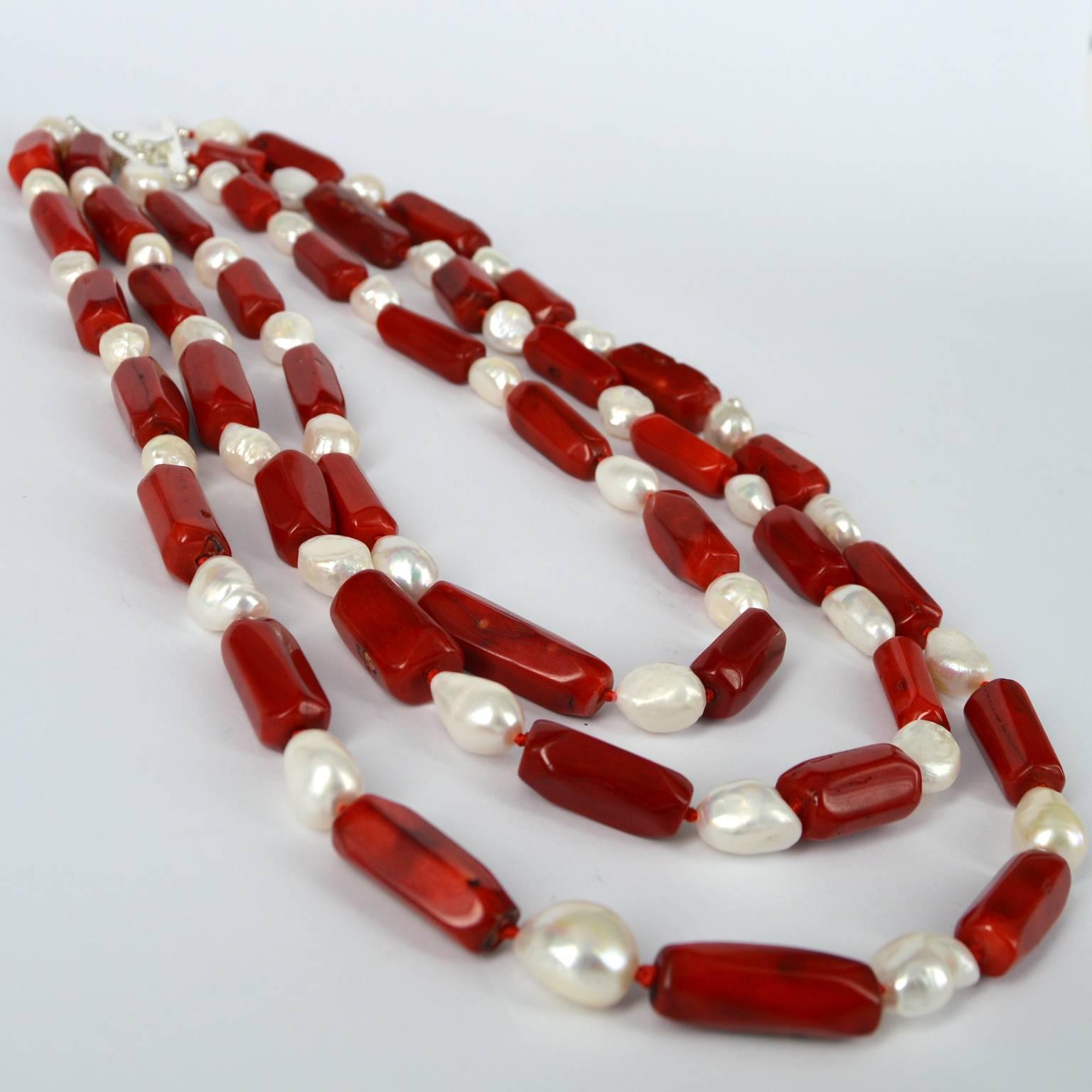 Vibrant A quality Sea Bamboo red Coral tubes measuring approximately 25x11mm are spaced with Fresh Water Baroque Pearls approximately 13x11mm, knotted on red thread with a stylish Sterling Silver clasp that can be worn to the front or back.
Shortest