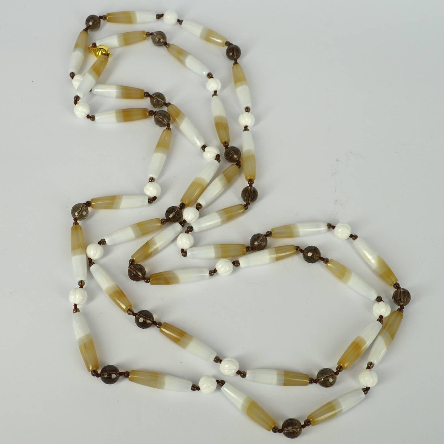 I fell in love with these unusual natural Banded agate long olive shaped tubes, the simplicity of the shape and tones made this necklace easy to design.
The tubes Agate beads are 34x8mm in size and they have a 3mm Smokey quartz beads on either side,