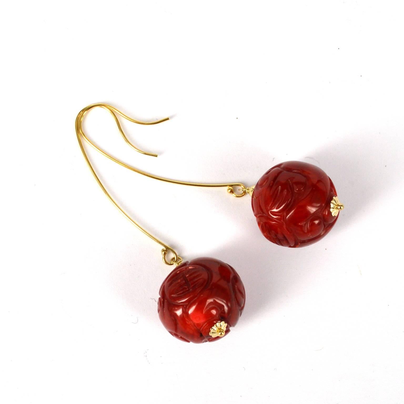 Carved Sea Bamboo Coral bead dyed red, each bead is 18mm in size.
14k gold filled sheppard measures 40mm.
Total length of earring is 65mm with each earring weighing 8.1g.