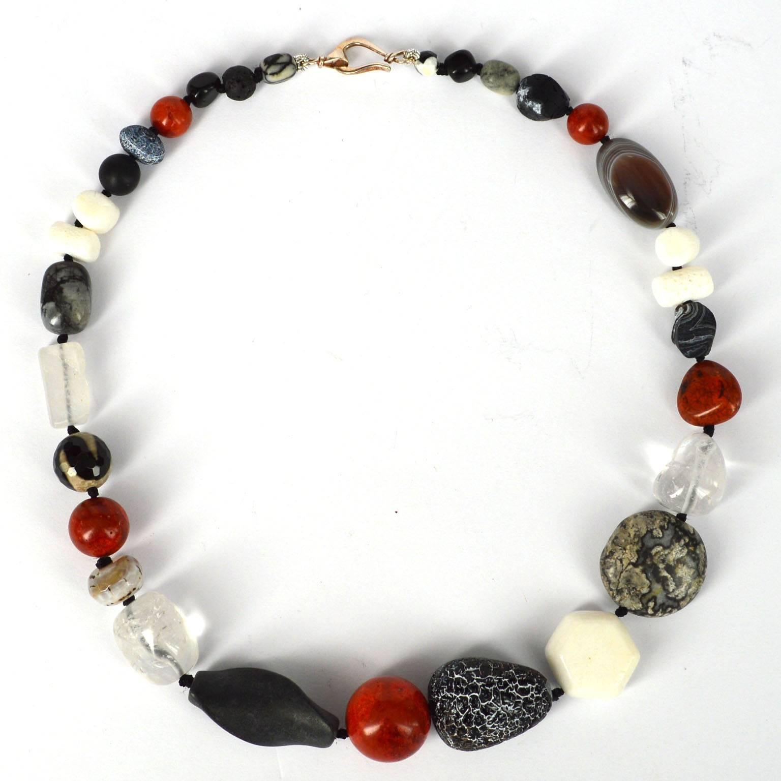 Classic combination of black, red and white with varying textures make this such a must have necklace. Centre feature stones measure: hexagonal white coral 20mm, Black crackled Agate teardrop nugget 28x20mm, sponge coral round bead 19.5mm and the