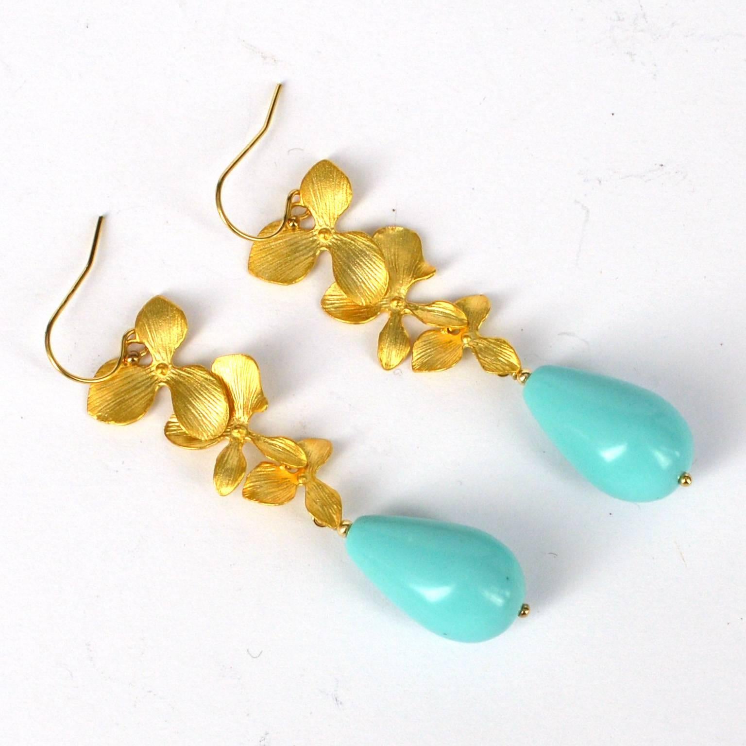 Delicate Gold plate Orchid drop with a 12x20mm Turquoise colour resin teardrop.
Sheppard and head pins are 14k Gold filled.
total length of earrings is 65mm 
We can make with other drops (gemstone or pearl) if requested, price will vary.