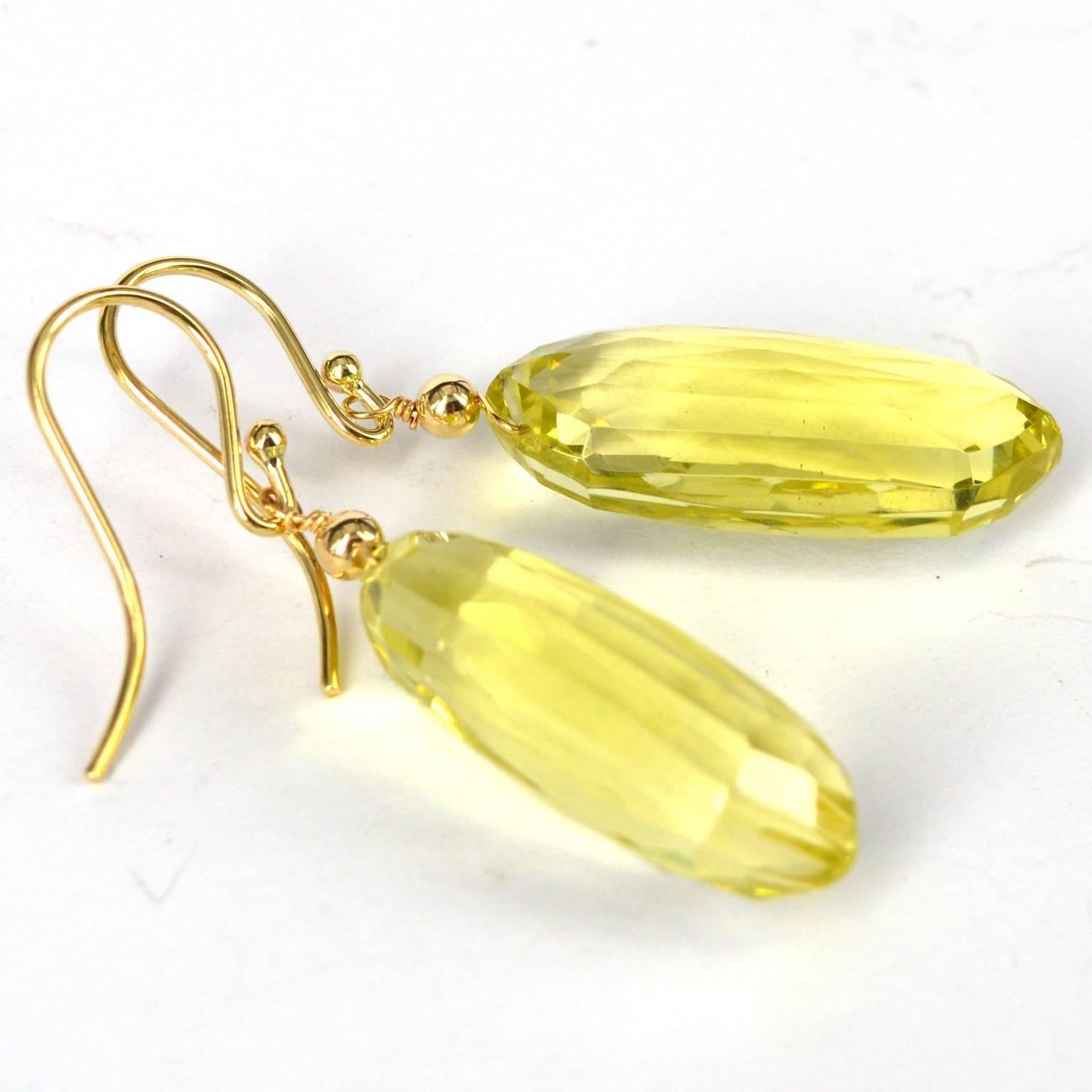 14 karat Gold Earrings with unusual fancy cut Lemon Quartz spears, stones measure 25x11mm.
total length of earrings is 44mm