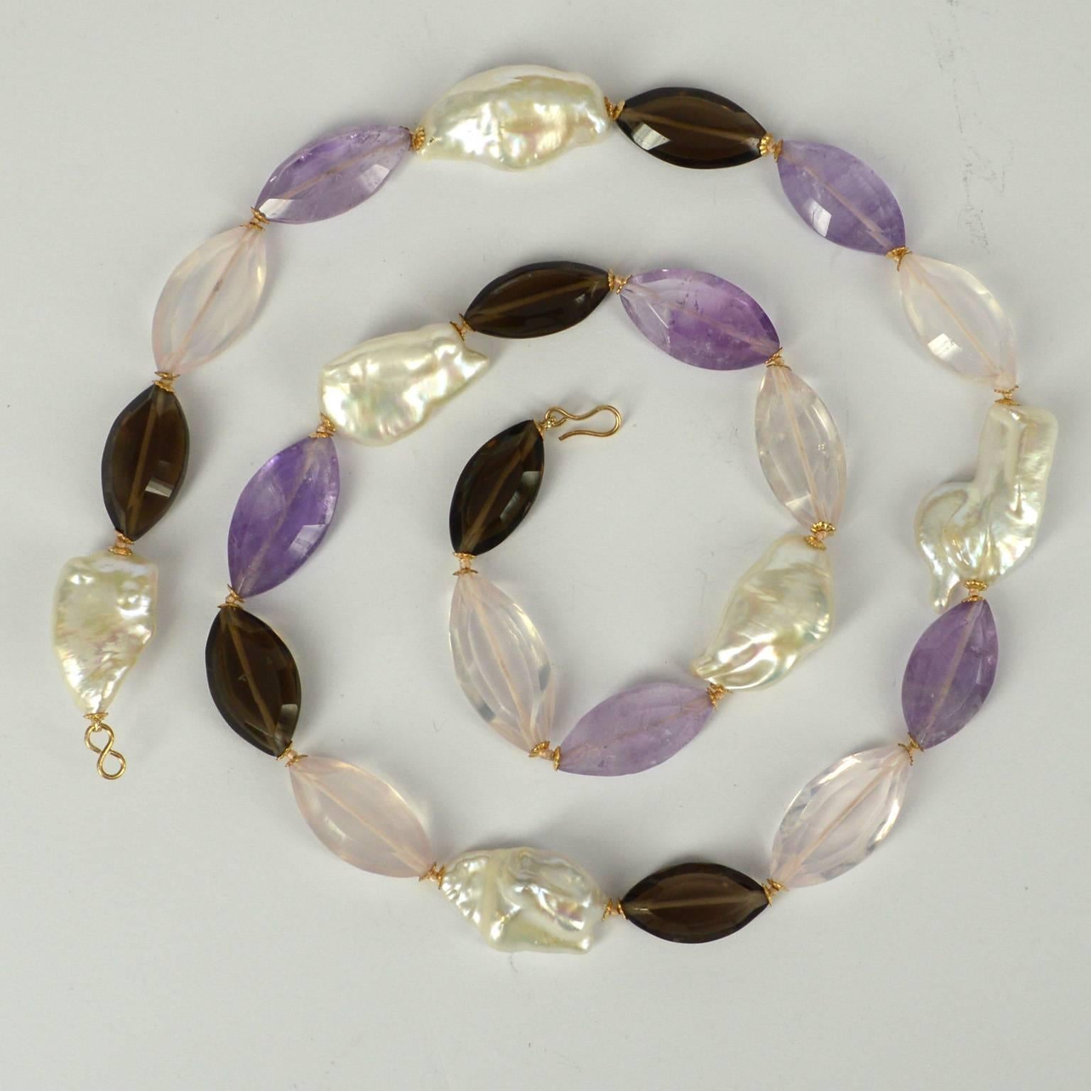 Long Keshi Fresh Water Pearls are matched with ellipse shaped Amethyst, Rose Quartz and Smokey Quartz beads, spaced with 14k Gold filled caps and hand knotted on pink thread. Stones range from 24-30mm and the Pearls from 26-31mm. Necklace is