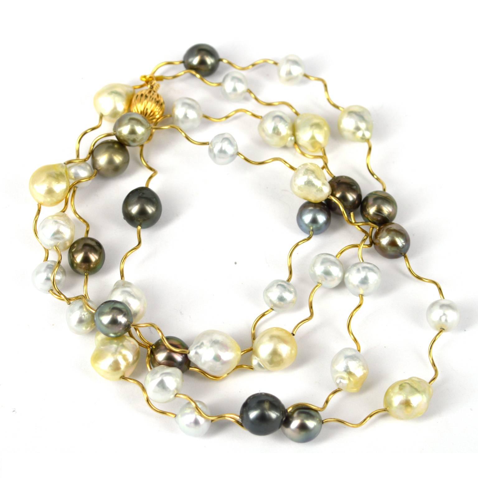 Long Tahitian and South Sea Pearl necklace with 14k gold filled twist tubes.
This 112cm necklace has a 10mm 14k gold filled clasp and can be worn long or as a double strand.