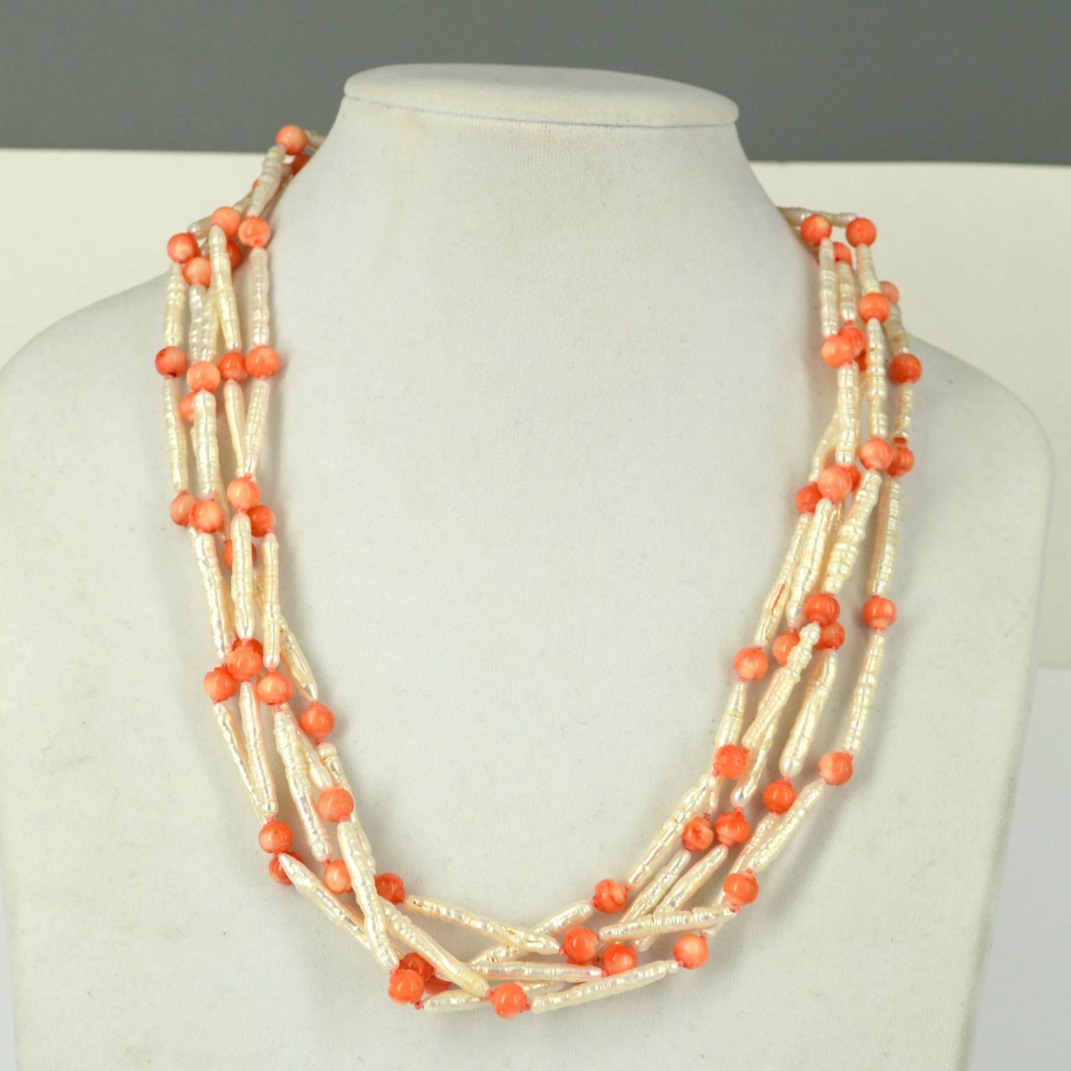 5 strands of fine stick 30x3mm Fresh Water Pearls necklace with 6mm hand carved Apricot Sea Bamboo Coral bead spacers.
Hand knotted on apricot thread with a Sterling Silver hook clasp and Cone.
56cm necklace in total.