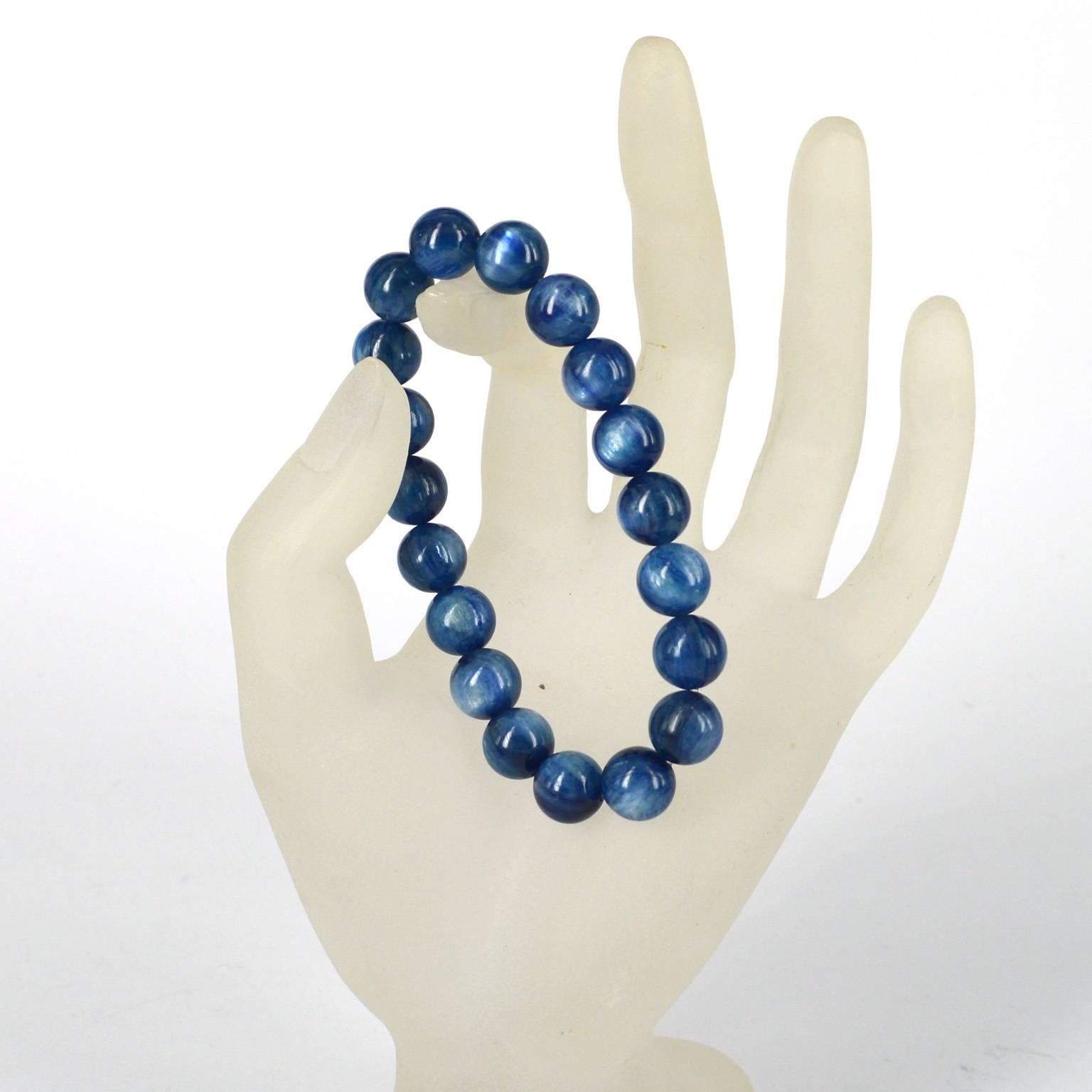 Gorgeous blue Kyanite beaded bracelet.
19 x 10mm polished round threaded on elastic.
Kyanite is a gemstone quality aluminum silicate sometimes referred to as disthene, rhaeticite or cyanite. Its name is derived from the Greek word 'kuanos' or