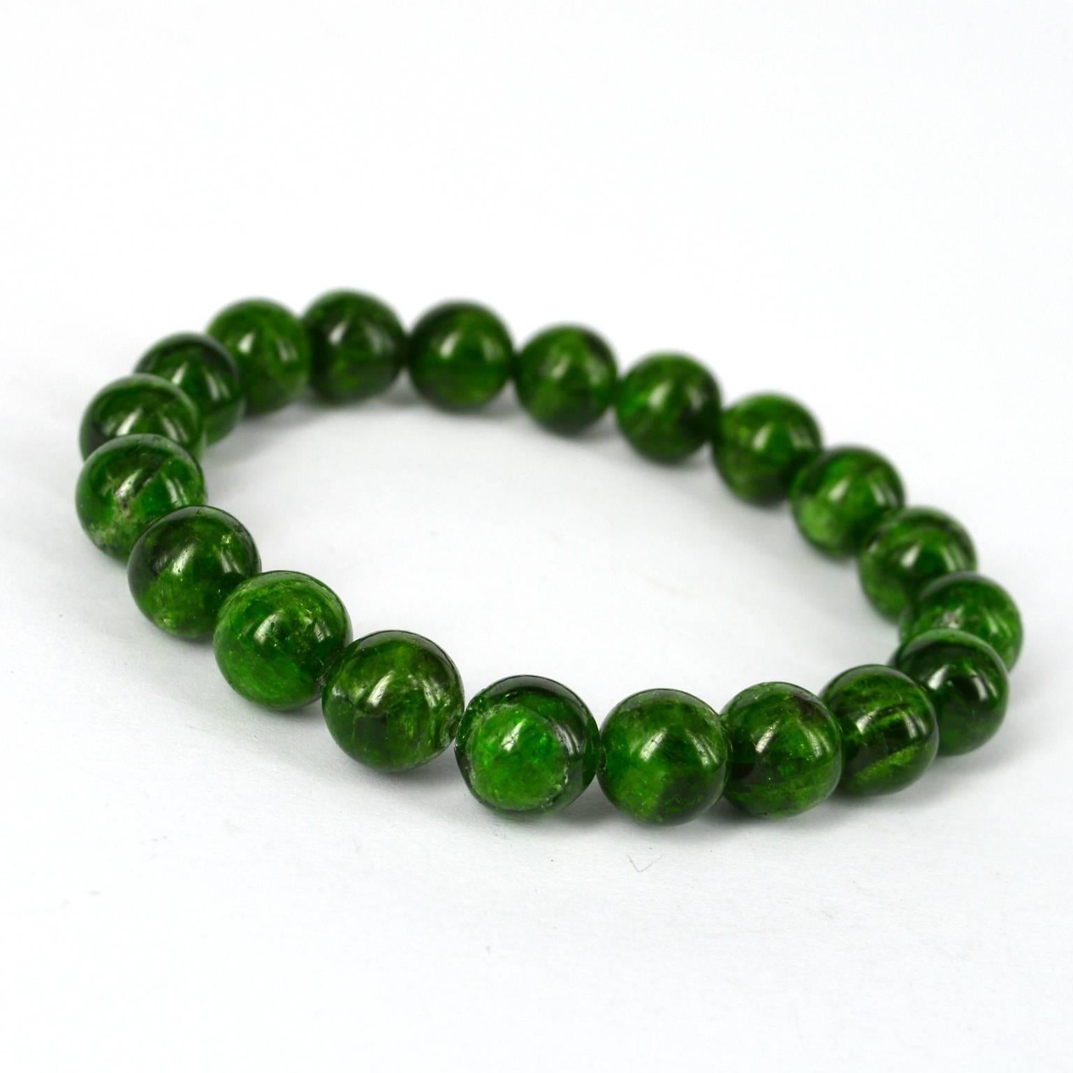 Chrome Diopside bracelet threaded on elastic.
20 x 10mm beads

Chrome diopside is a chromium-rich, transparent to translucent variety of gemstone-quality calcium magnesium silicate. It is one of the rarer varieties of diopside and belongs to the