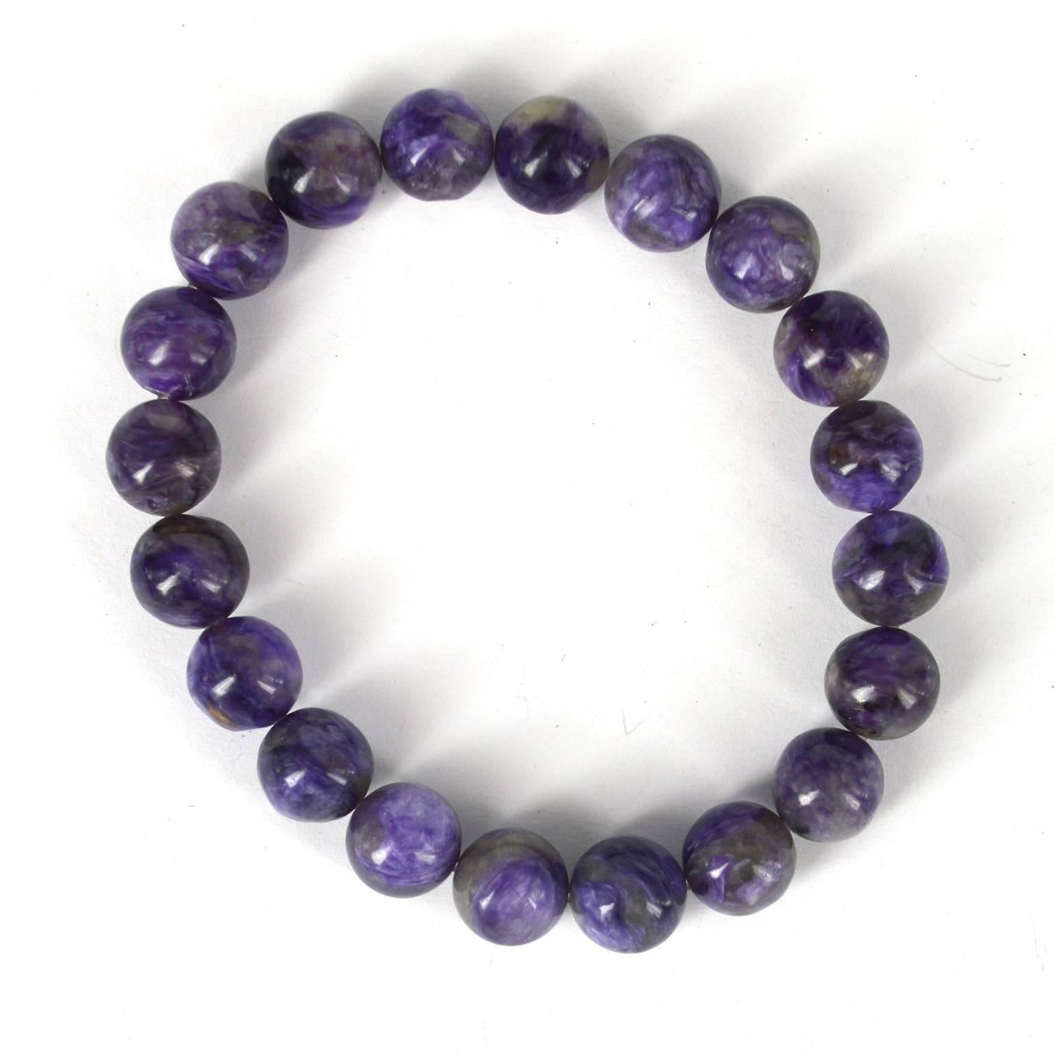 10mm polished Charite beads threaded on elastic.
20 x high quality Charite beads
Charoite is a rare silicate mineral with a very complex chemical composition of phosphorus, calcium, and sodium. ... The colors of charoite are indeed unmistakable and