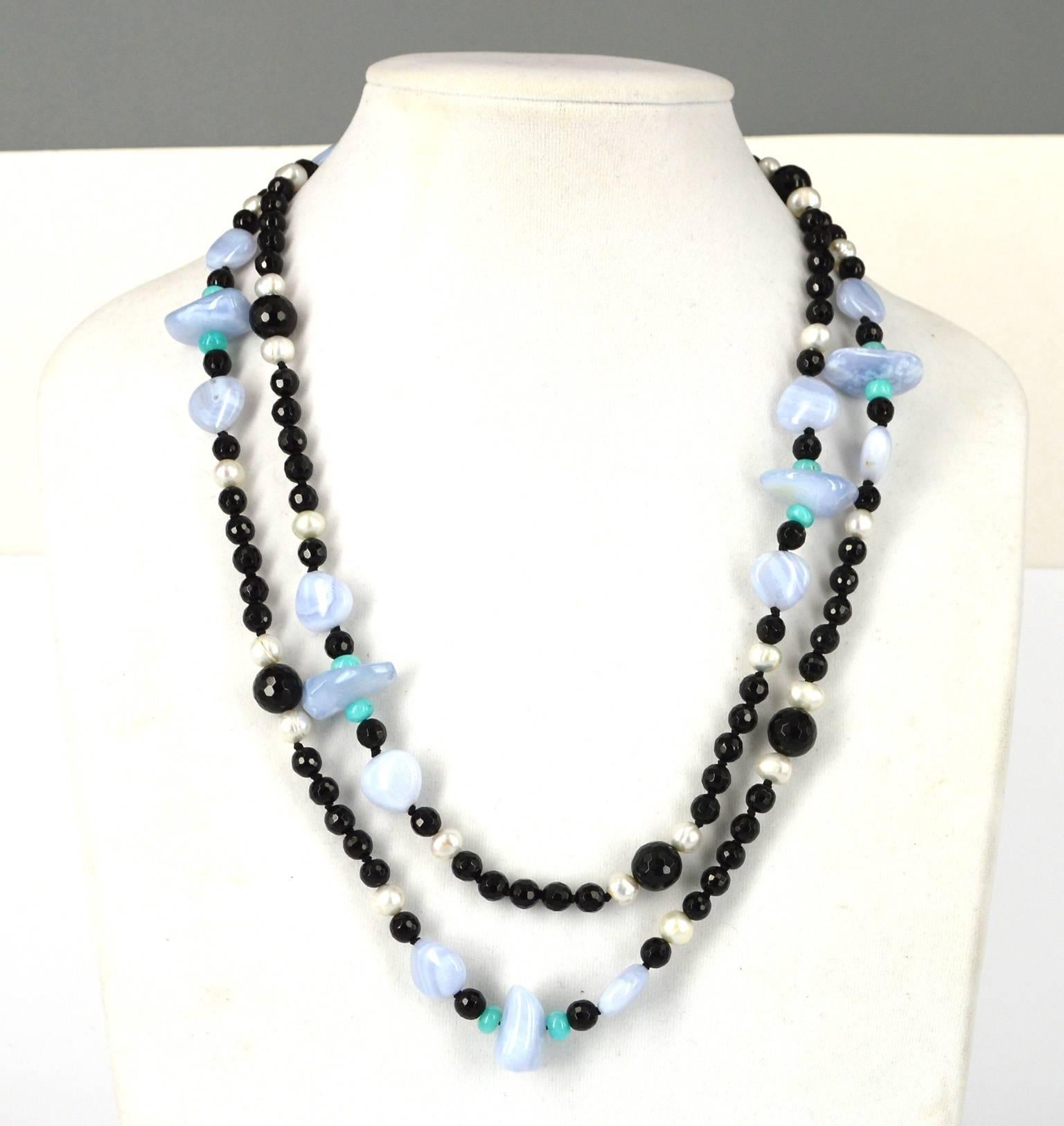 Long necklace with a mix of Blue Lace Agate, 7mm Fresh Water Pearls, 6mm & 10mm faceted Onyx rounds and Peruvian Amazonite rondels.
8mm Sterling Silver clasp hand knotted on a black thread.
Bead size range from 6mm - 15mm
Total necklace length 116cm