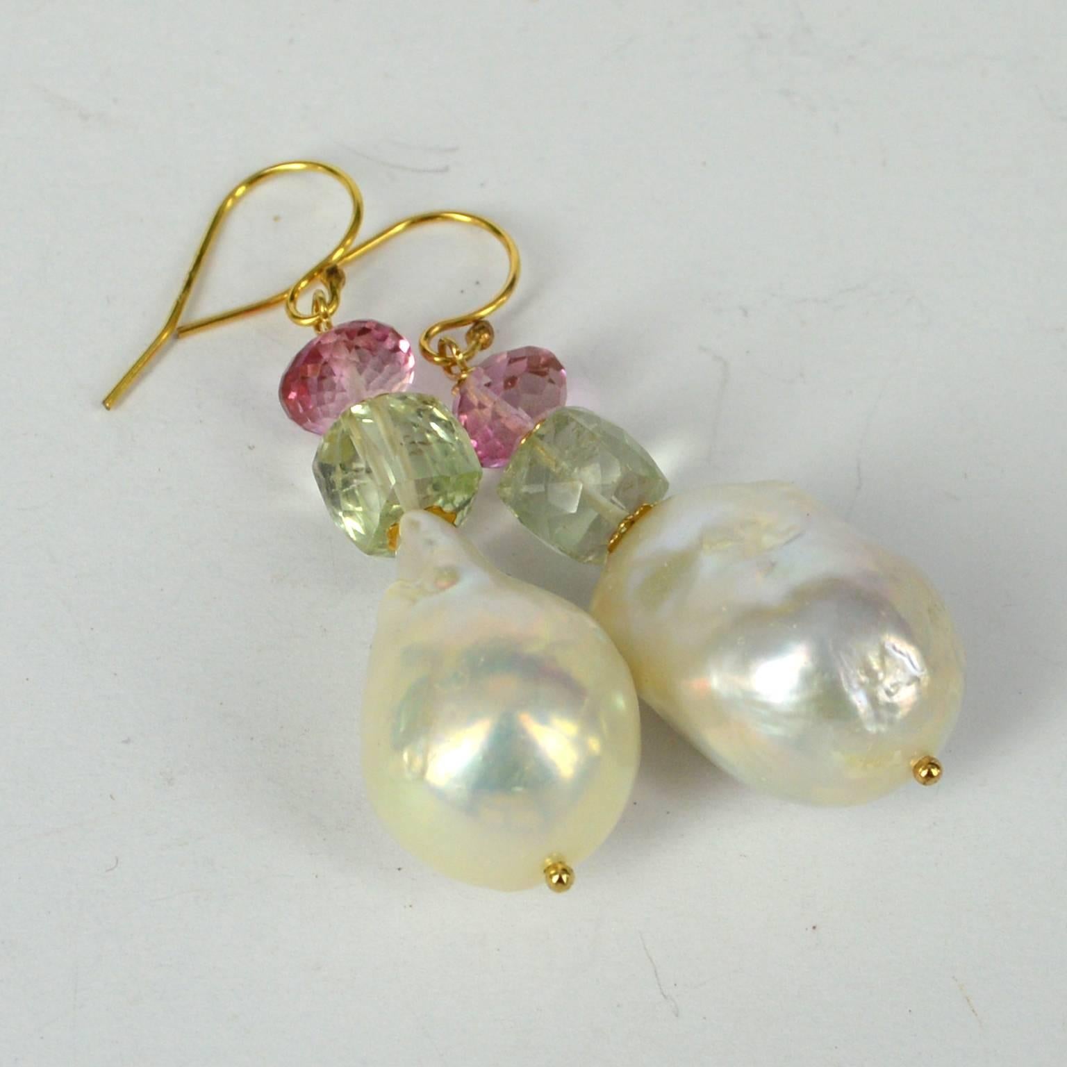 Beautiful soft colours in this earring made high quality stones and Pearls, from 16x18mm Baroque Fresh Water Pearls with 8mm Faceted Green Amethyst Cubes  and 7x4mm Faceted Roundel Pink Topaz beads.
All Findings are 14k Gold Filled.
Earring length