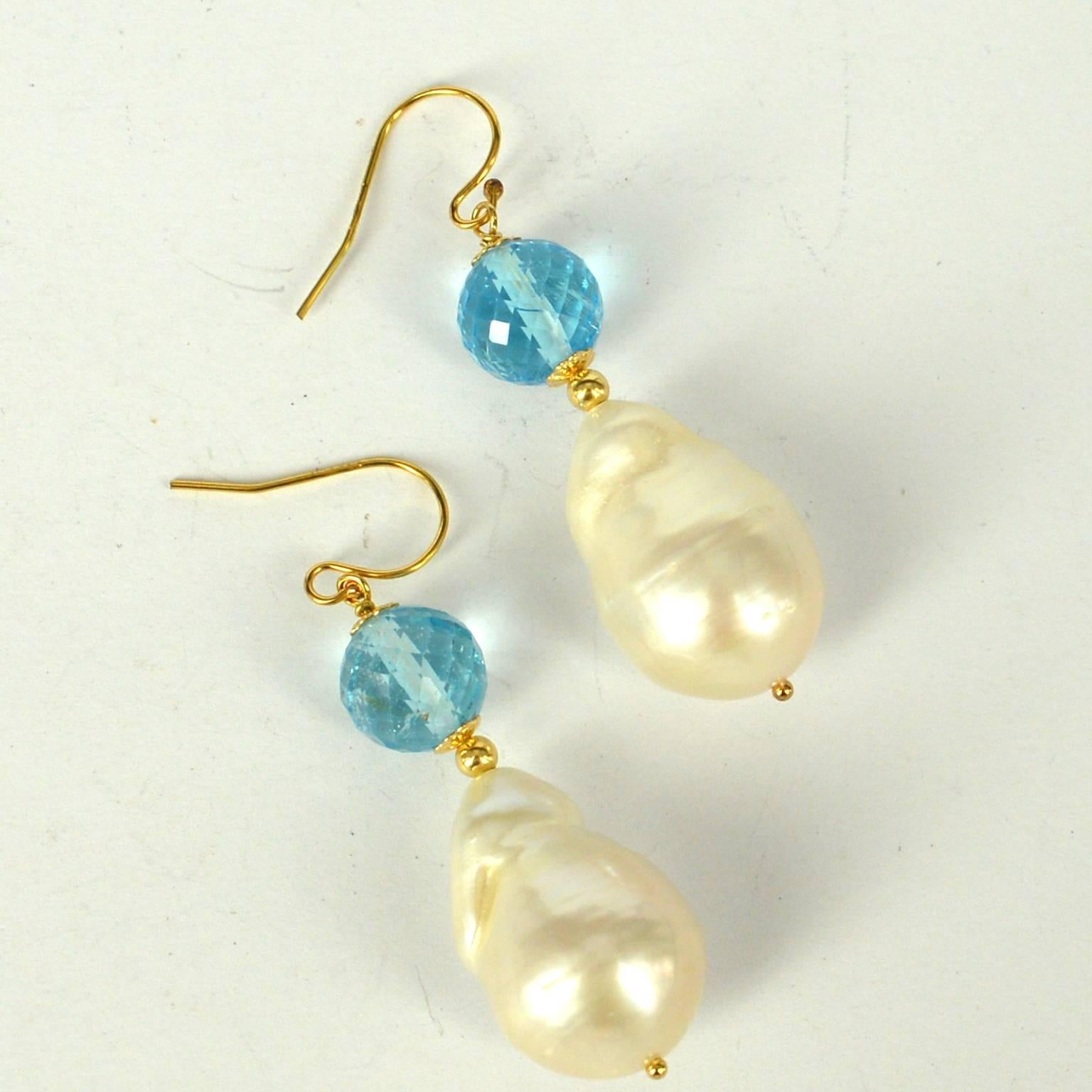 Stunning multi faceted 10mm high quality Blue Topaz with teardrop Baroque Fresh Water Pearls 22x15mm.
Metal 14k Gold Filled
total earring length 50mm
