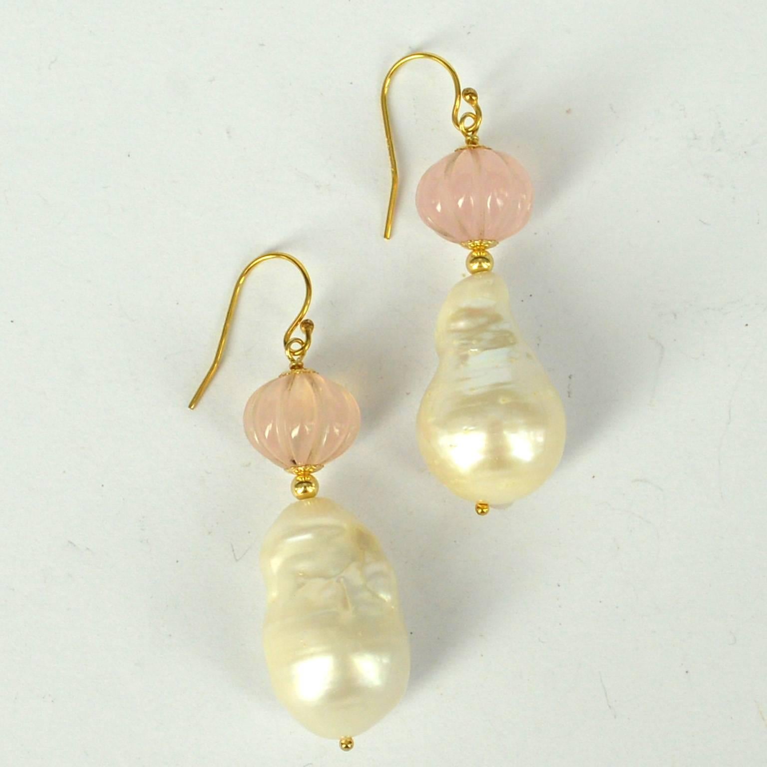 Stunning hand carved melon Shaped Rose Quartz with a high Quality Baroque Fresh Water Pearl.
Rose Quartz Beads measure 12x11mm with a 15x24mm Pearl.
All findings are 14k Gold Filled
length of Earrings is 50mm