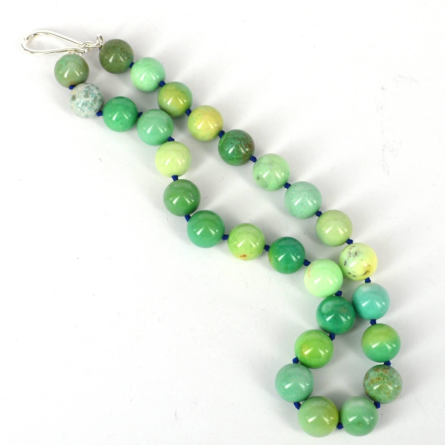 Stunning natural tones in this Green Grass Agate necklace, stones measure 16mm each and are hand knotted on blue thread for strength and durability, with a 35mm Sterling Silver hook clasp.
total necklace length is 54cm.
custom alteration available,