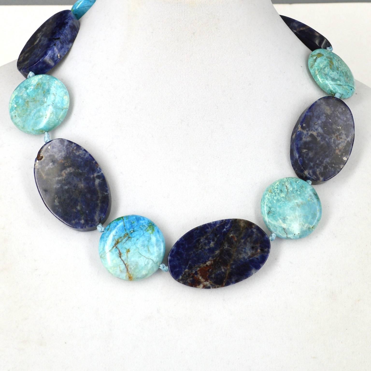 Large flat oval beads in 30x45mm Sodalite with 30mm round African Blue Opal hand knotted on Aqua coloured thread for strength and durability, with a 29cm Sterling silver hook clasp.
Finished necklace measures 49cm