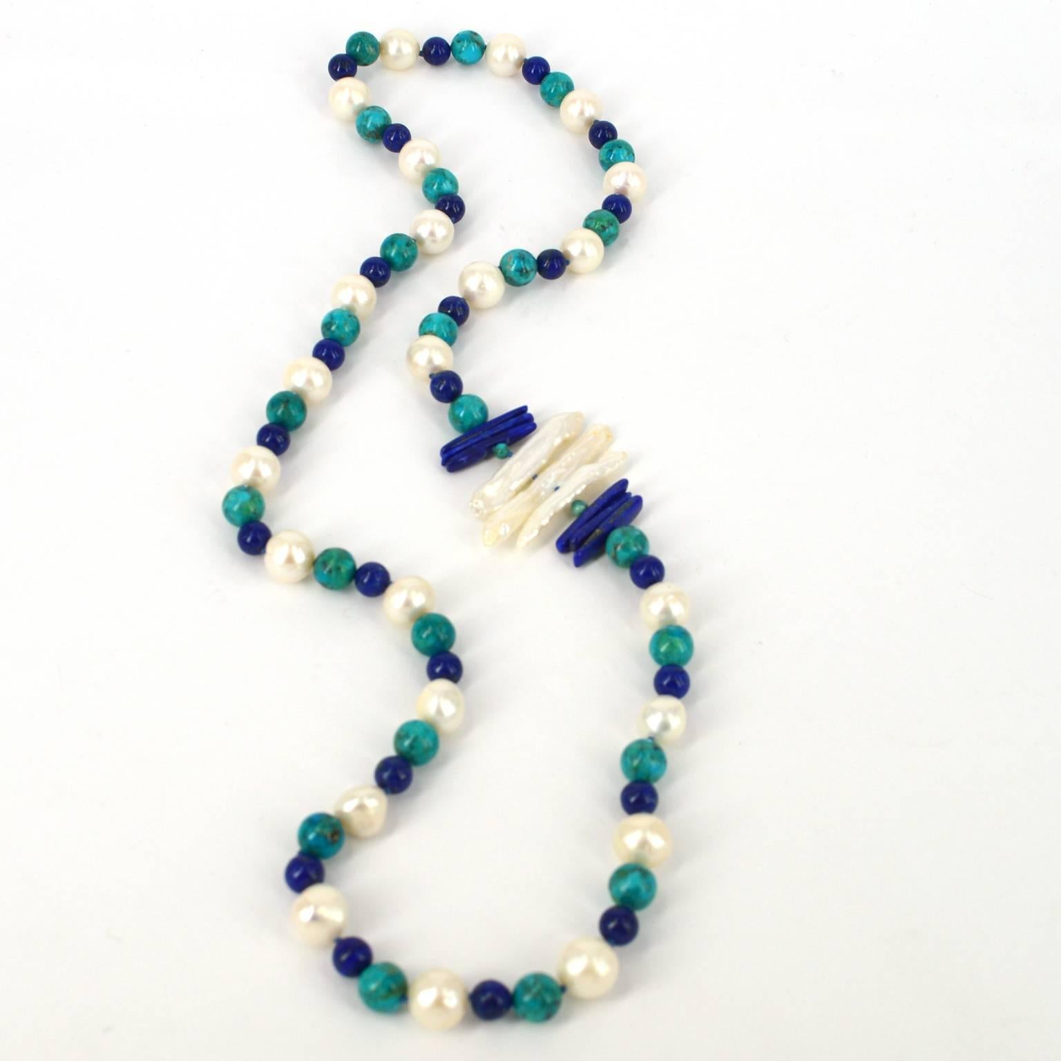 Copella, magical depths of colour, designed with natural stones and pearls to excite your passions. Hand Knotted natural 10mm Chinese Turquoise, 8mm Lapis Lazuli with 12mm Fresh Water Pearls and Biwa  pearls.  8mm brushed Sterling Silver