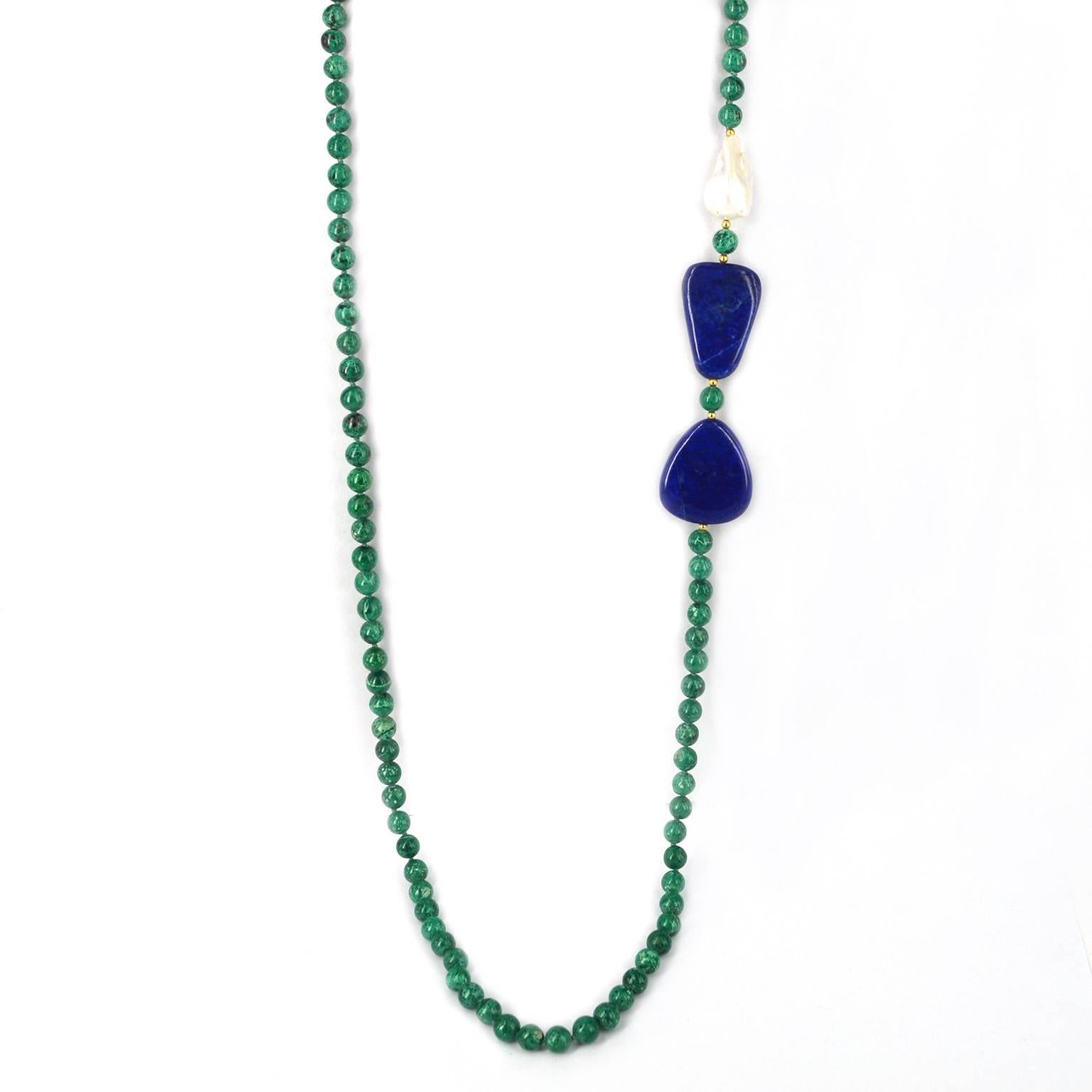 A combination of flat polished Lapis Lazuli, Freshwater Baroque Pearl and Chrysocolla beads hand knotted on thread. 14k gold filled beads highlight this feature.
8mm polished round Chrysocolla beads, Lapis beads are approximately 35mm each and the