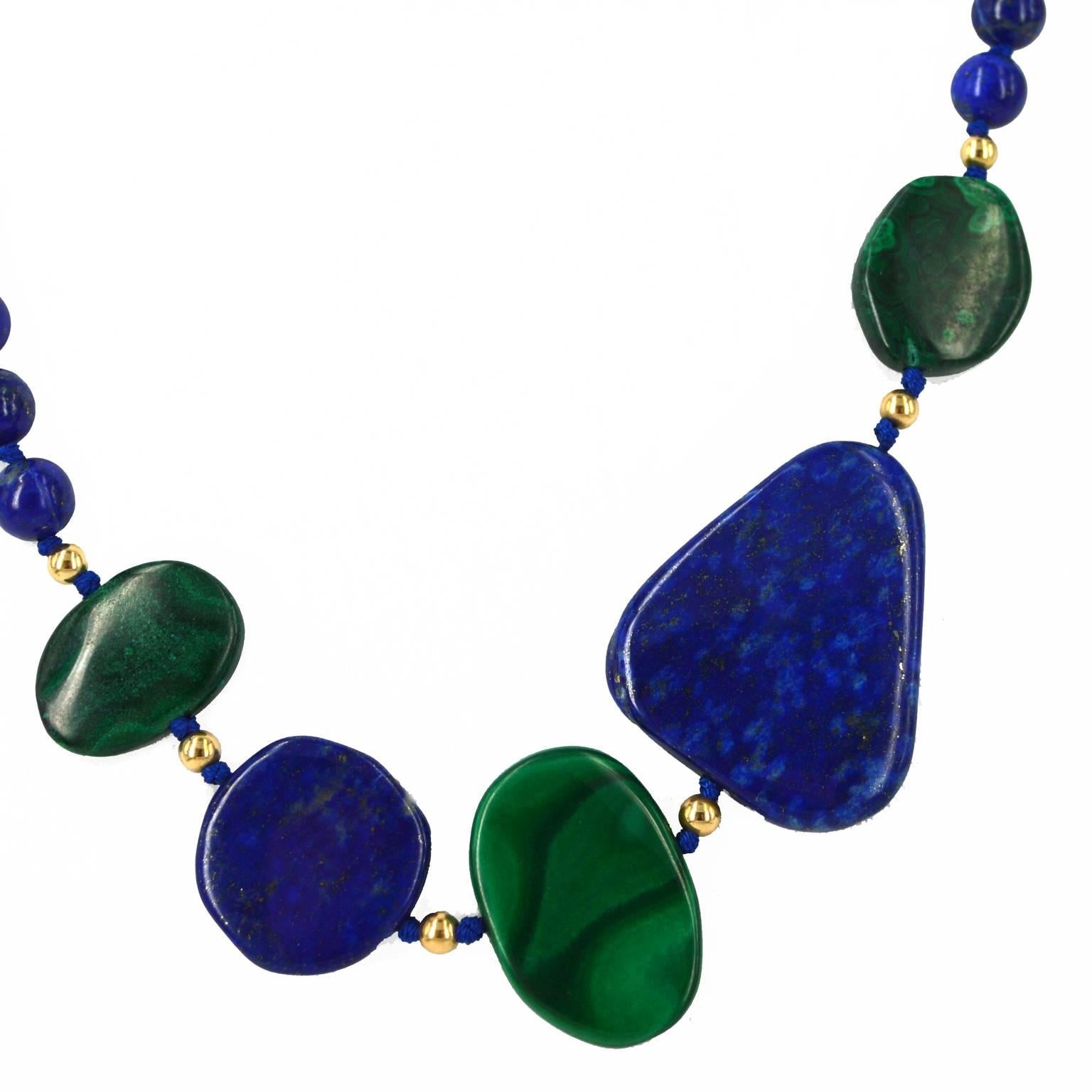 A grade natural 8mm Lapis Lazuli Beads sit at the back of this necklace which has 3 natural Malachite flat oval nuggets 21-28mm at the longest measurement, with 2 natural Lapis Lazuli nuggets 20-35mm long. Necklace has 3mm round 14k Gold filled