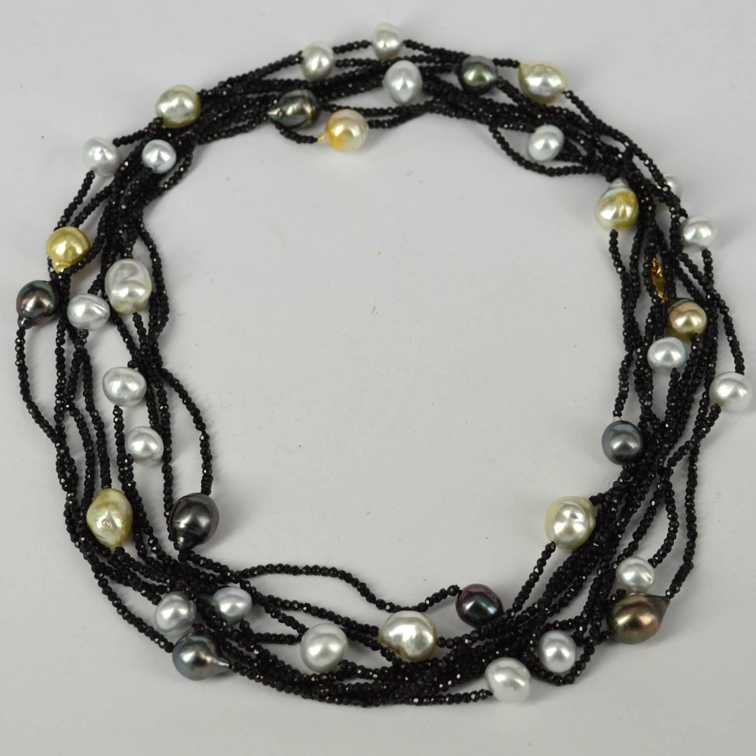 Extra long 4 metre necklace can be worn wrapped around the neck short or long or wrapped around the wrist many times.
11 strands of faceted 2mm black Spinel beads and 37 Pearls were used to make this stunning piece, knotted every 10mm for strength