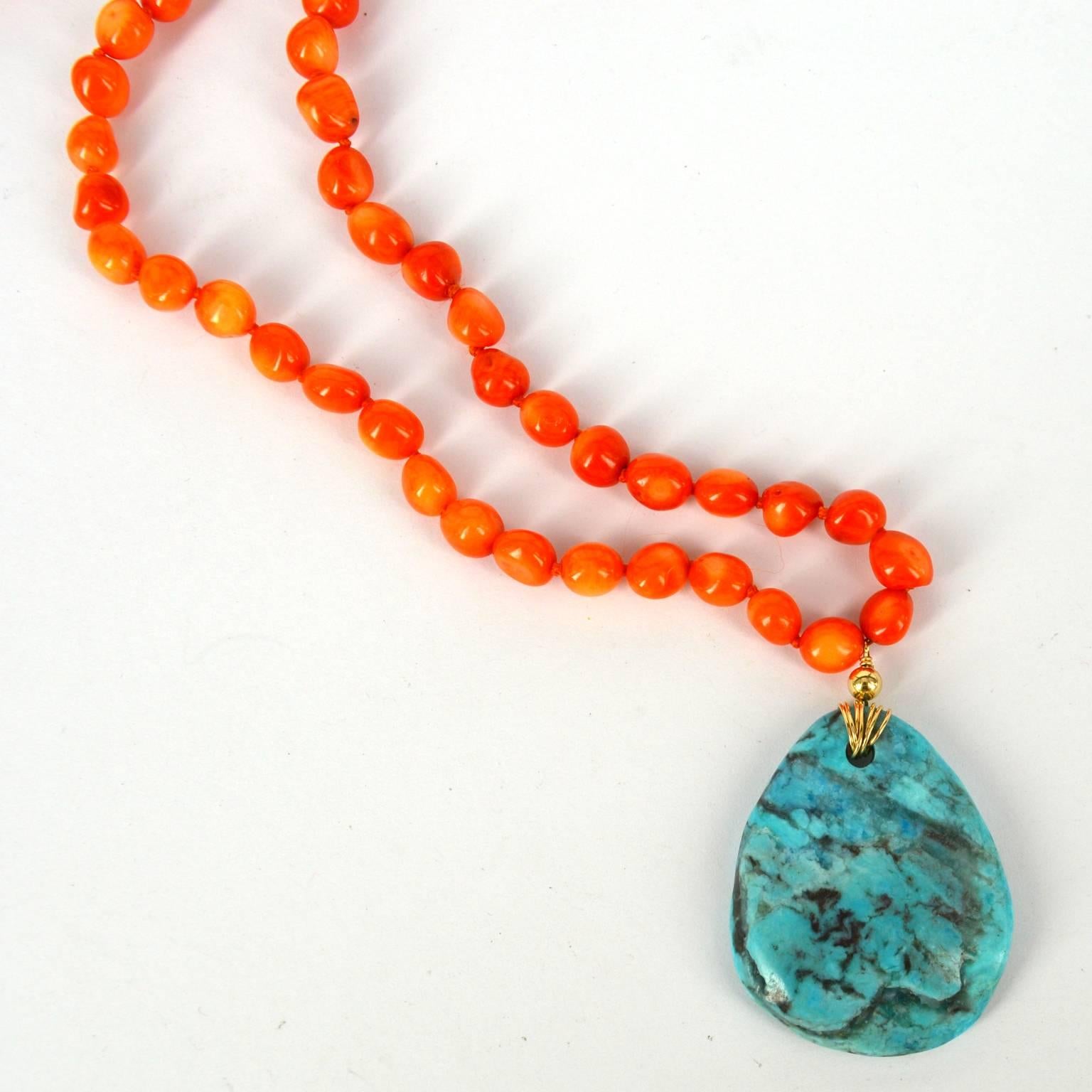 Long and versatile necklace can be worn long or wrapped twice around the neck. Orange Sea Bamboo Coral nuggets with a natural turquoise Pendant. Coral nuggets approx 8mm with a 40x30mm turquoise pendant, hand knotted with a 8mm 14k Gold filled