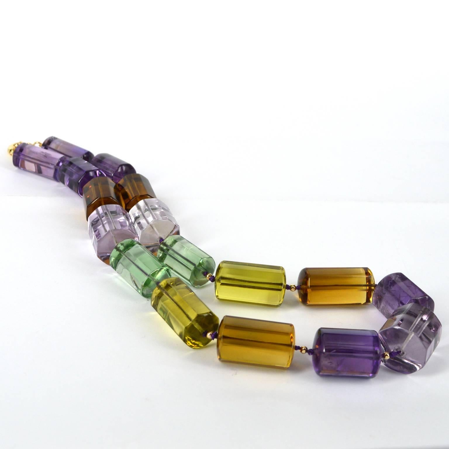 Huge Tubes of Multi-coloured Amethyst, light dark purple and green combine with Lemon and Beer Quartz make this is a magnificent one off piece. Beads range in size from 13 x 29mm to 21 x 23mm for the centre stone. Spaced with 14k Gold 3mm round
