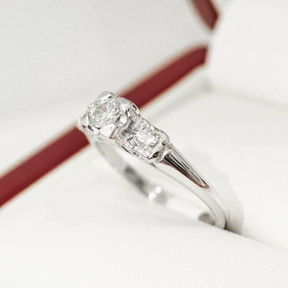 Modernist Three-Stone Diamond Platinum Past Present Future Engagement Ring For Sale