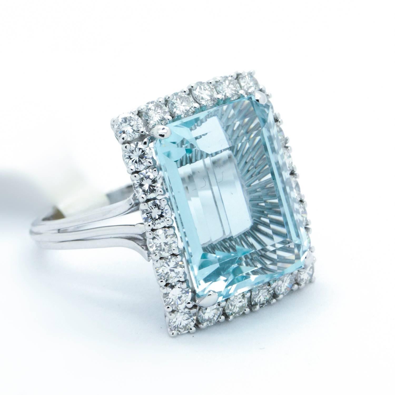 Stunner. This Handmade, large and elegant Vintage Aquamarine and G / VS Diamond Platinum Cocktail Dinner is a one of a kind piece that showcases a beautiful near perfect, natural Aquamarine. The Diamonds surrounding it are of excellent quality and