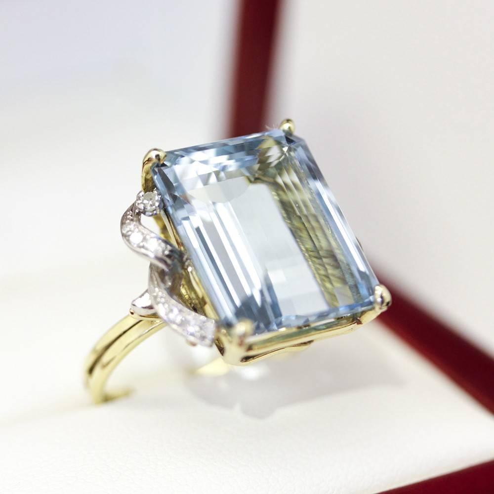 This amazing large Aquamarine Dinner ring (1940's Cocktail ring) is spectacular with its scrolled Platinum and diamond accents. Amazing original piece. A Vintage Aquamarine Cocktail Dinner ring with Diamonds in Platinum and Yellow Gold. Truly