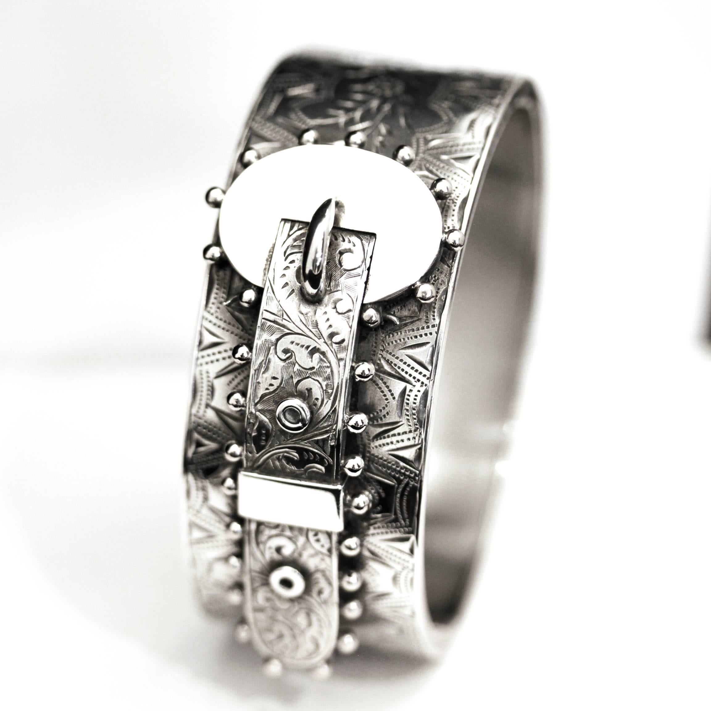 Antique Victorian Sterling Silver hinged buckle bangle, with Hallmarks

Antique silver buckle bangle has been crafted in sterling silver. The anterior face of the bangle is ornamented with an applied buckle set in relief with bright cut stylised