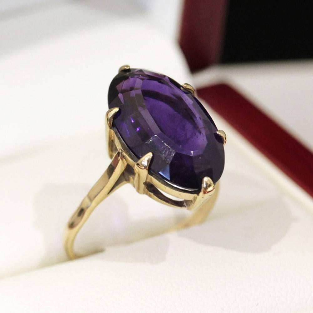 Fabulous Vintage Large Oval cut Natural Amethyst Yellow gold cocktail ring. Measuring approximately 2.5cm in length this is a gorgeous ring.   The deep, rich natural purple Amethyst needs nothing else to set it off.  A Simple, elegant, statement