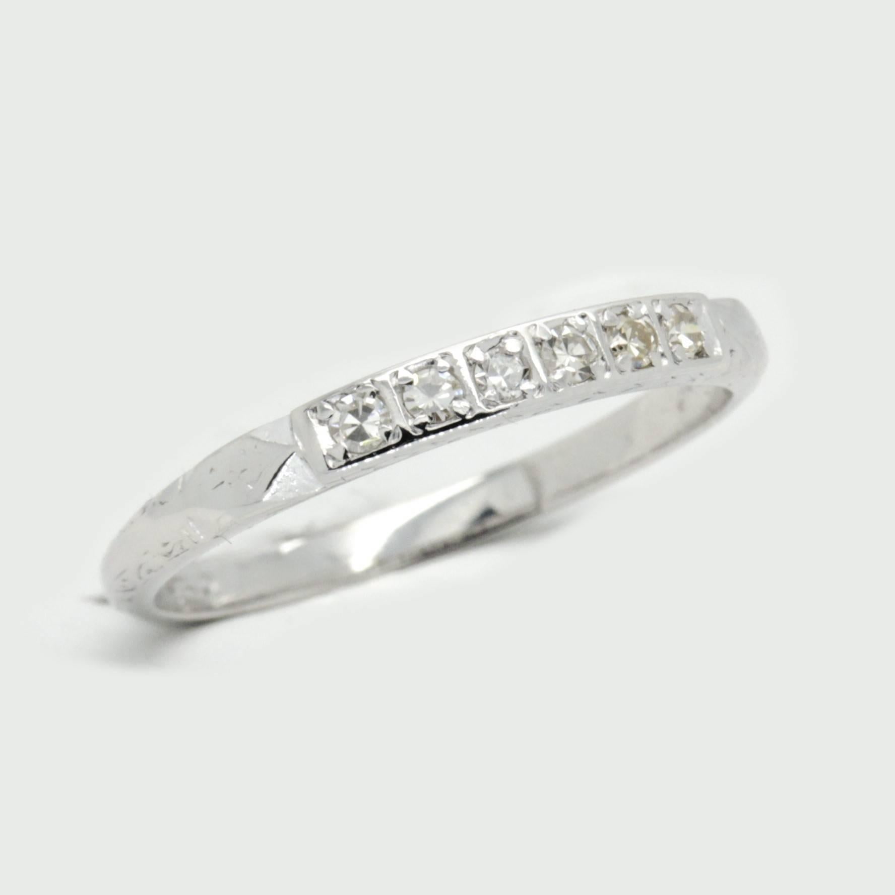 Stunning 18ct white gold, Art Deco Diamond Eternity ring

18ct white gold eternity ring, narrow, high half round, tapered shank, polished finish.

Diamonds:
Six bead set single cut Diamonds, clarity is VS1- S1, colour is I-J
Dimensions = 1.6mm
Total