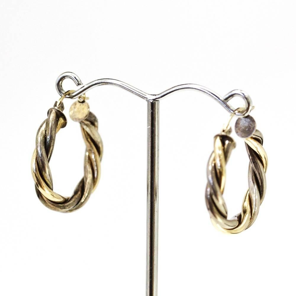 Lovely Vintage lightweight, easy to wear, Gold twist hoop earrings in two tone 10k gold. Flip up post for extra security for those of us that lose earrings on a regular basis.  

Dimensions: 2.5cm x 2.5cm