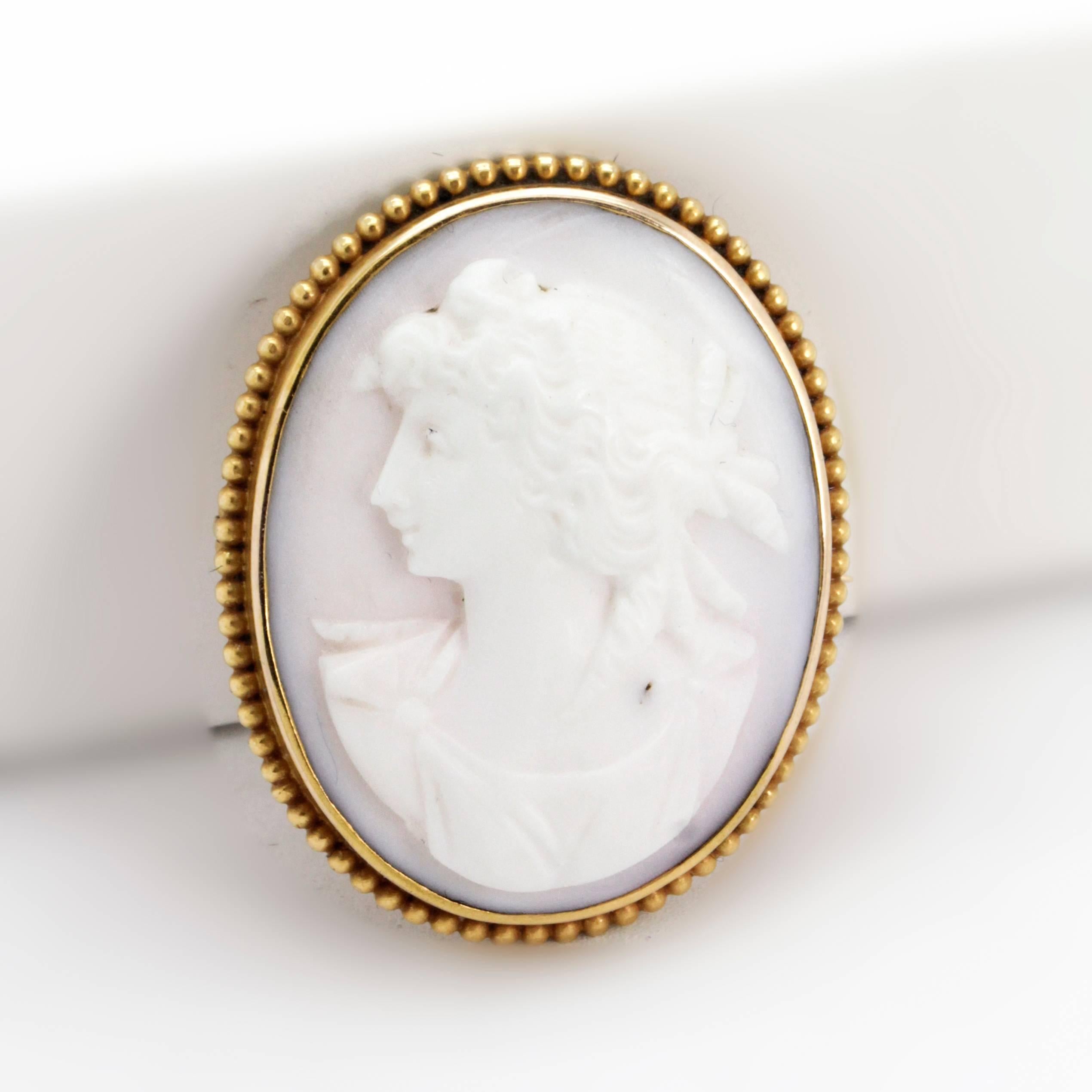 Lovely Victorian Shell Coral Cameo brooch /pin with intricate carving into shell of a Victorian woman with fabulous features and curly locks. 

Very sweet and in very good condition Brooch in 9 ct yellow to rose gold

Approximate Dimensions:
Width =