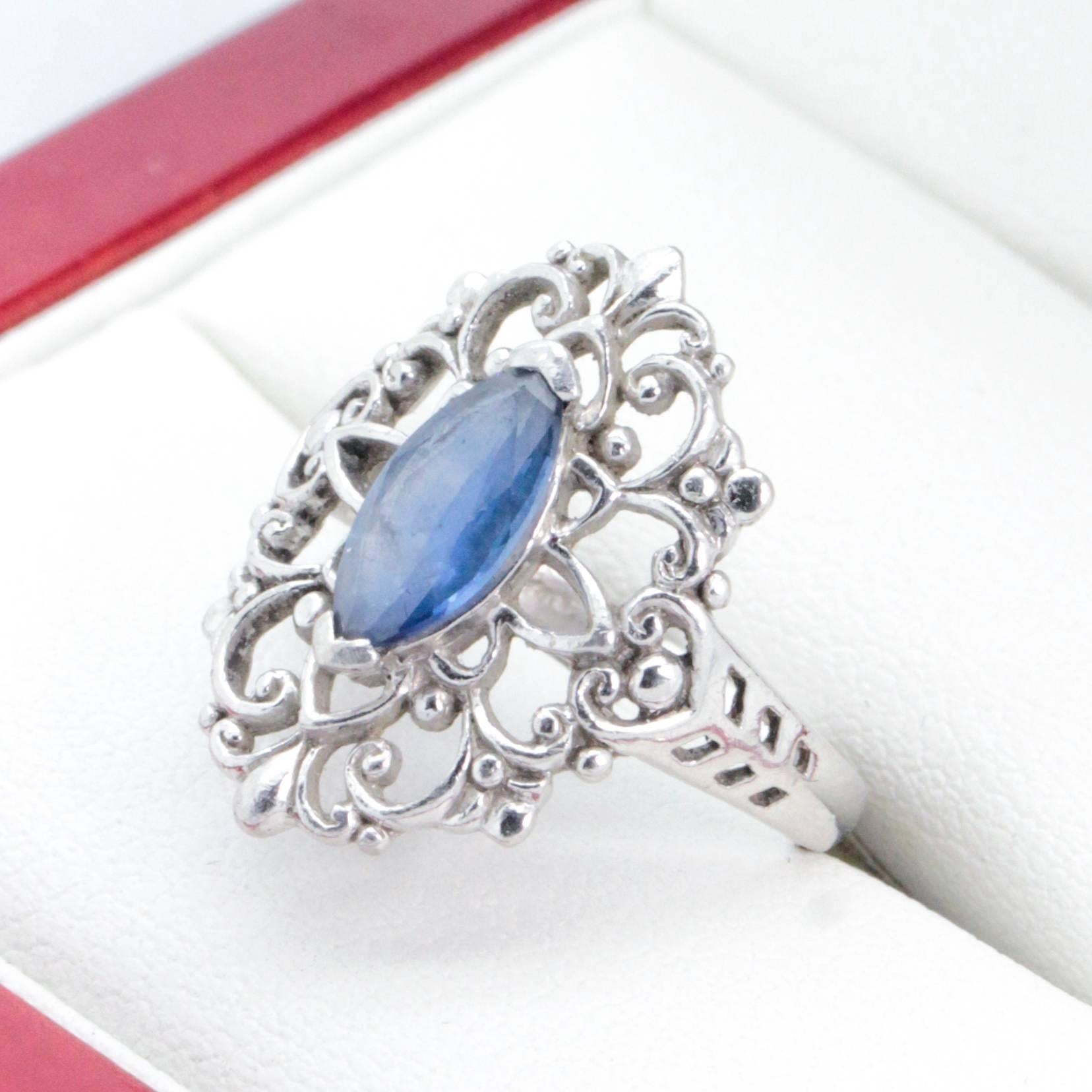 Very nice Platinum Filigree ring with Marquise Sapphire. All natural Platinum Sapphire filigree ring featuring a marquise-cut sapphire, end set, surrounded by a filigree design. 4.20 - 1.95mm wide half round shank, stamped 10% pall, plat. The ring